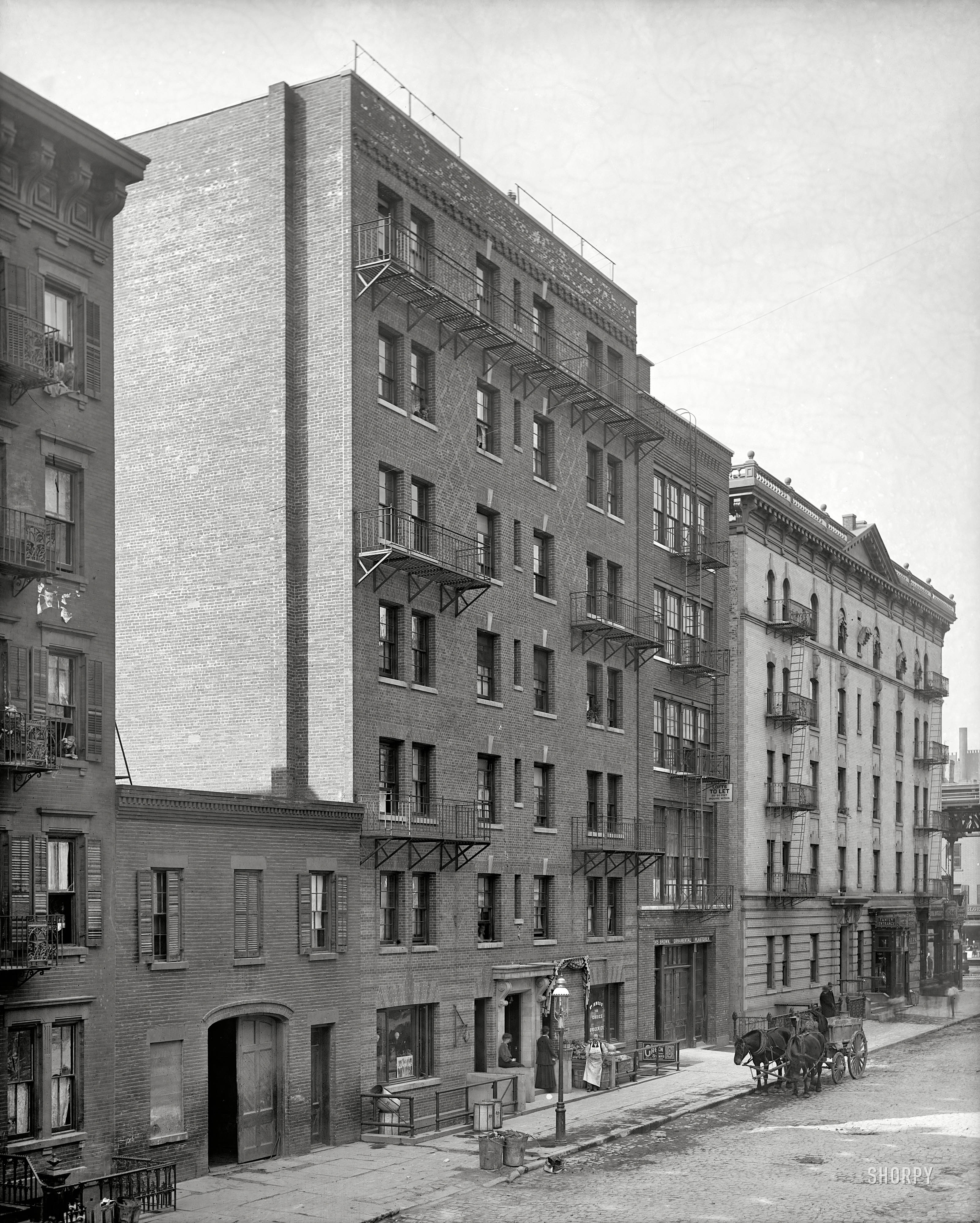 New York circa 1905. "Exterior of tenement house." Another view of the building on East 40th Street seen here. 8x10 inch glass negative. View full size.