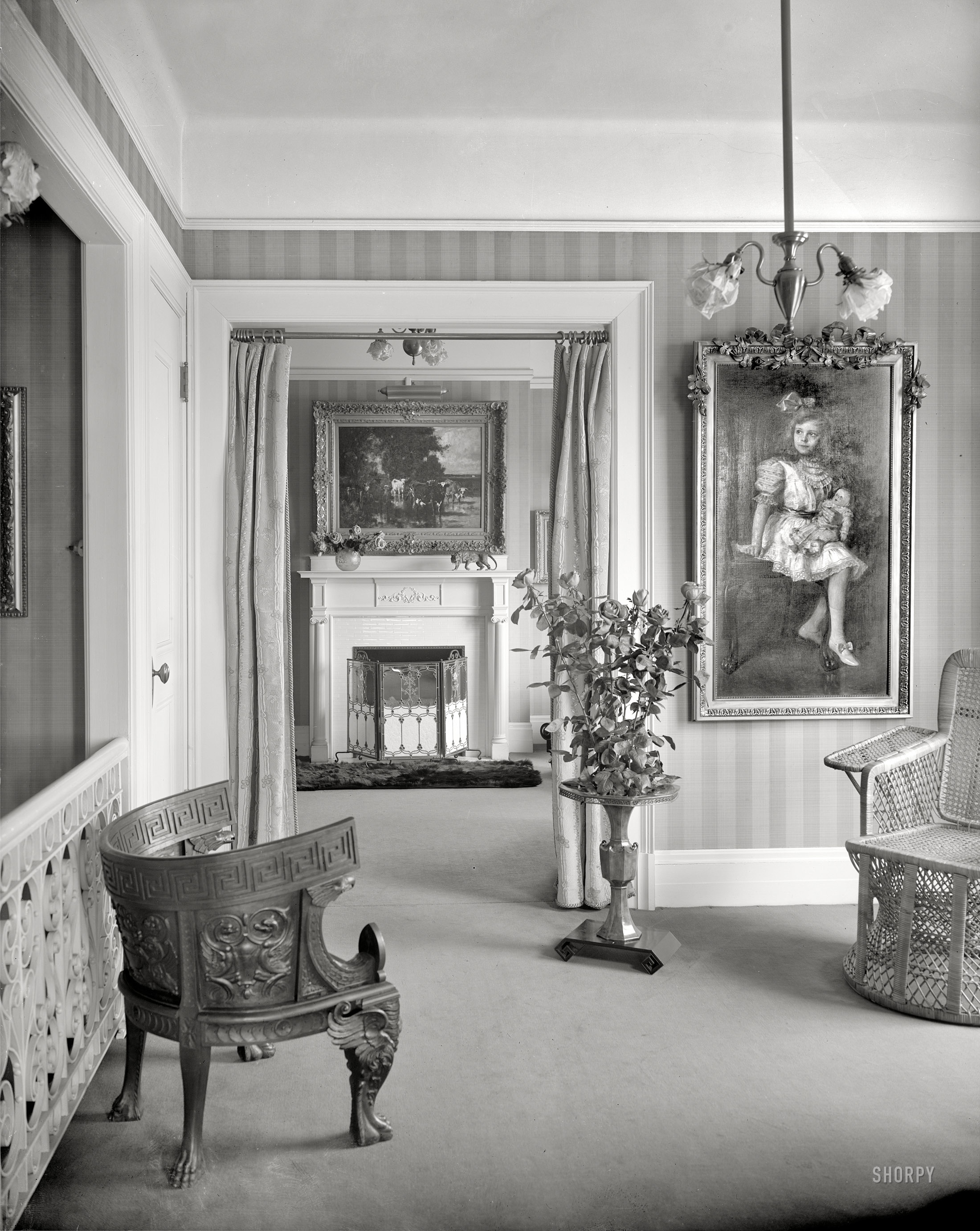Circa 1915. "Room with painting of child, roses, and portiere." A room with a view, or possibly a narrative. Detroit Publishing Co. glass negative. View full size.