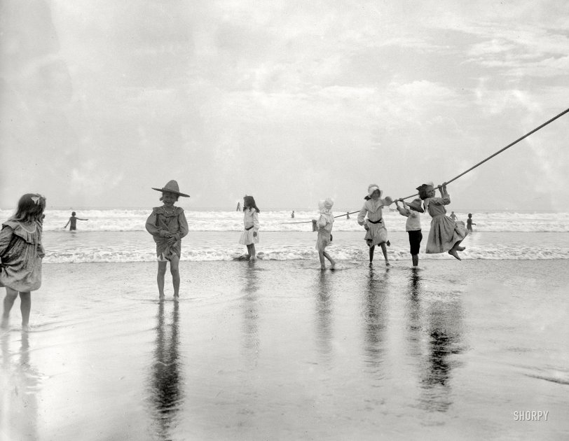New York circa 1905. "Surf bathing at Coney Island. Children swinging on pier rope." 8½ x 6½ glass negative, Detroit Publishing Company. View full size.
