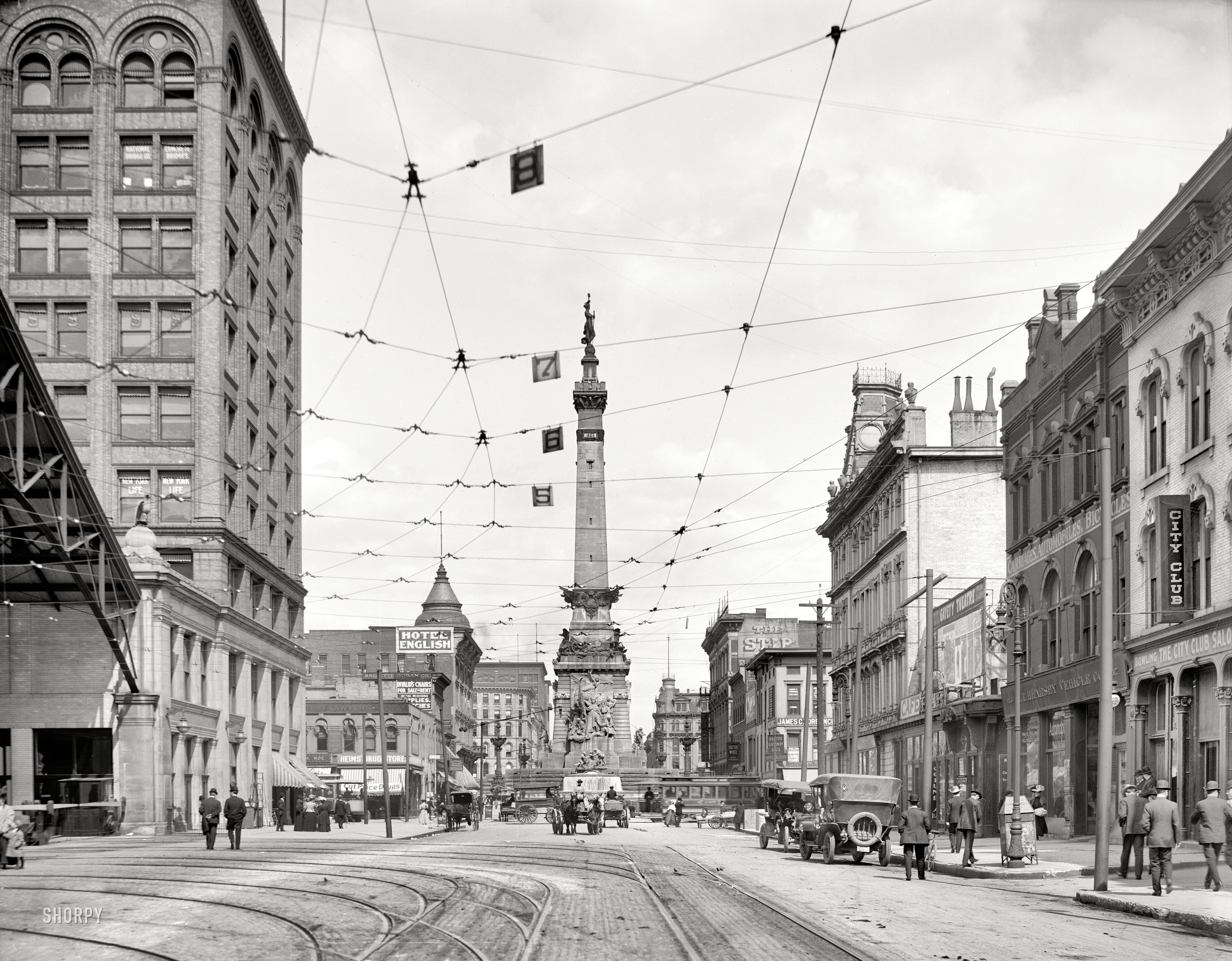 Indianapolis, Indiana, circa 1907. "West Market Street." Another view of the Union Terminal building and car barn seen in the previous post. Points of interest include the 1902 Soldiers and Sailors Monument, the Hearsey Vehicle Company to the right (dealer in gasoline, steam and electric automobiles) and, farther down the street, medical offices of Dr. Gasaway & Co., "specialists." View full size.