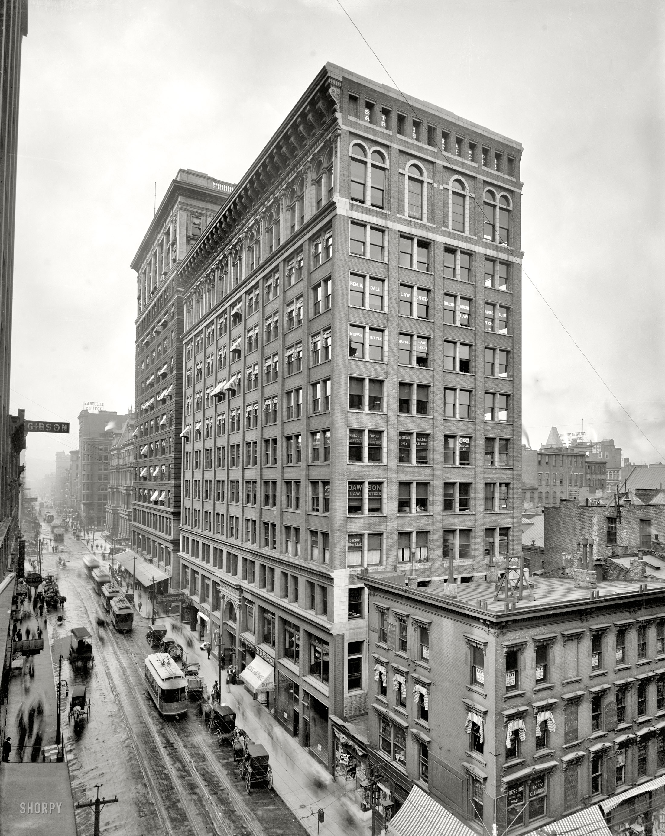 Cincinnati circa 1910. "Mercantile Library Building, Walnut Street." Note plants and bottle on the sills of Dr. Ellen M. Kirk. A year ago we saw the other end of this block here. 8x10 glass negative, Detroit Publishing Co. View full size.