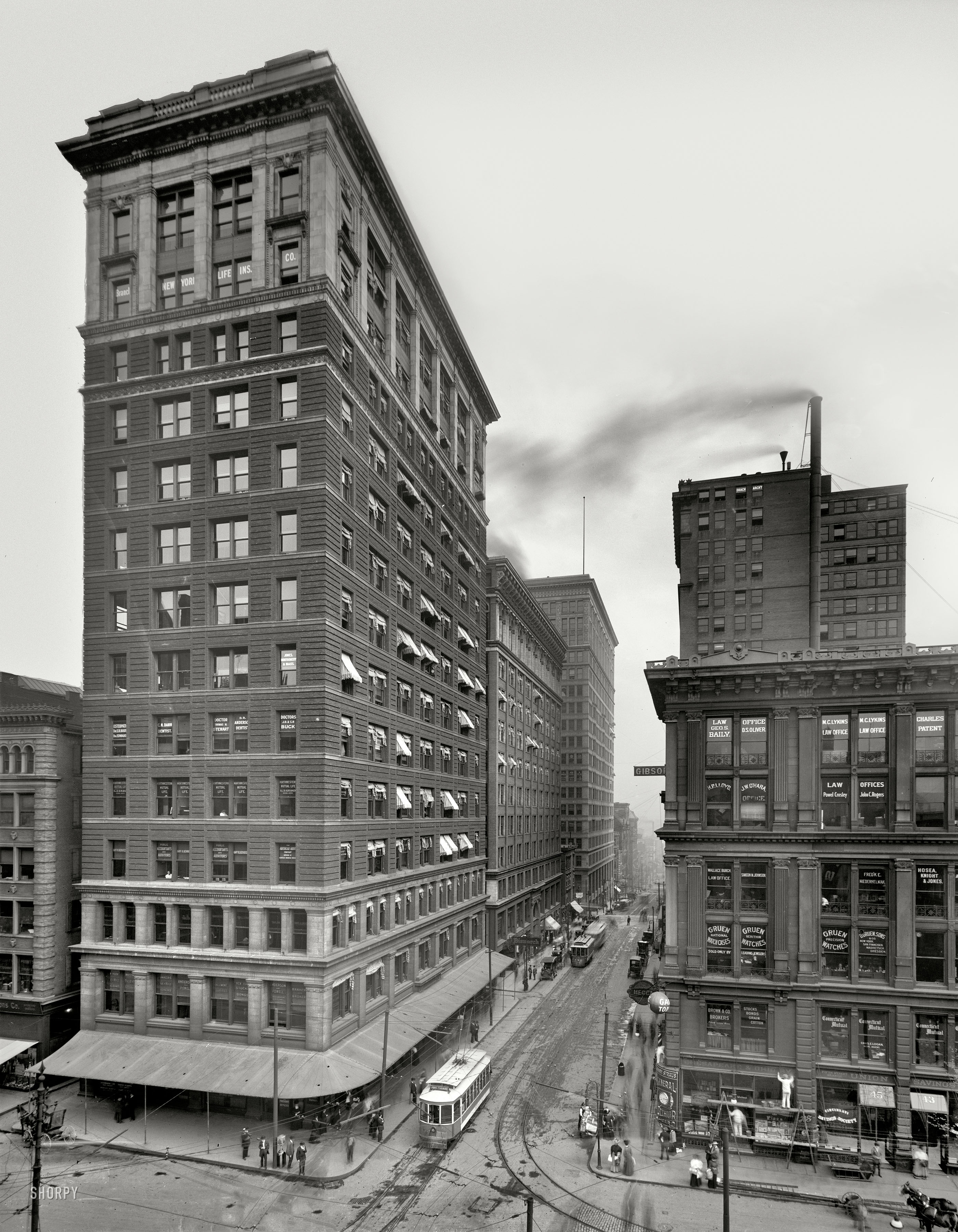 Cincinnati, Ohio, circa 1910. "Walnut Street." A detailed street scene in the business district. Detroit Publishing Co. glass negative. View full size.