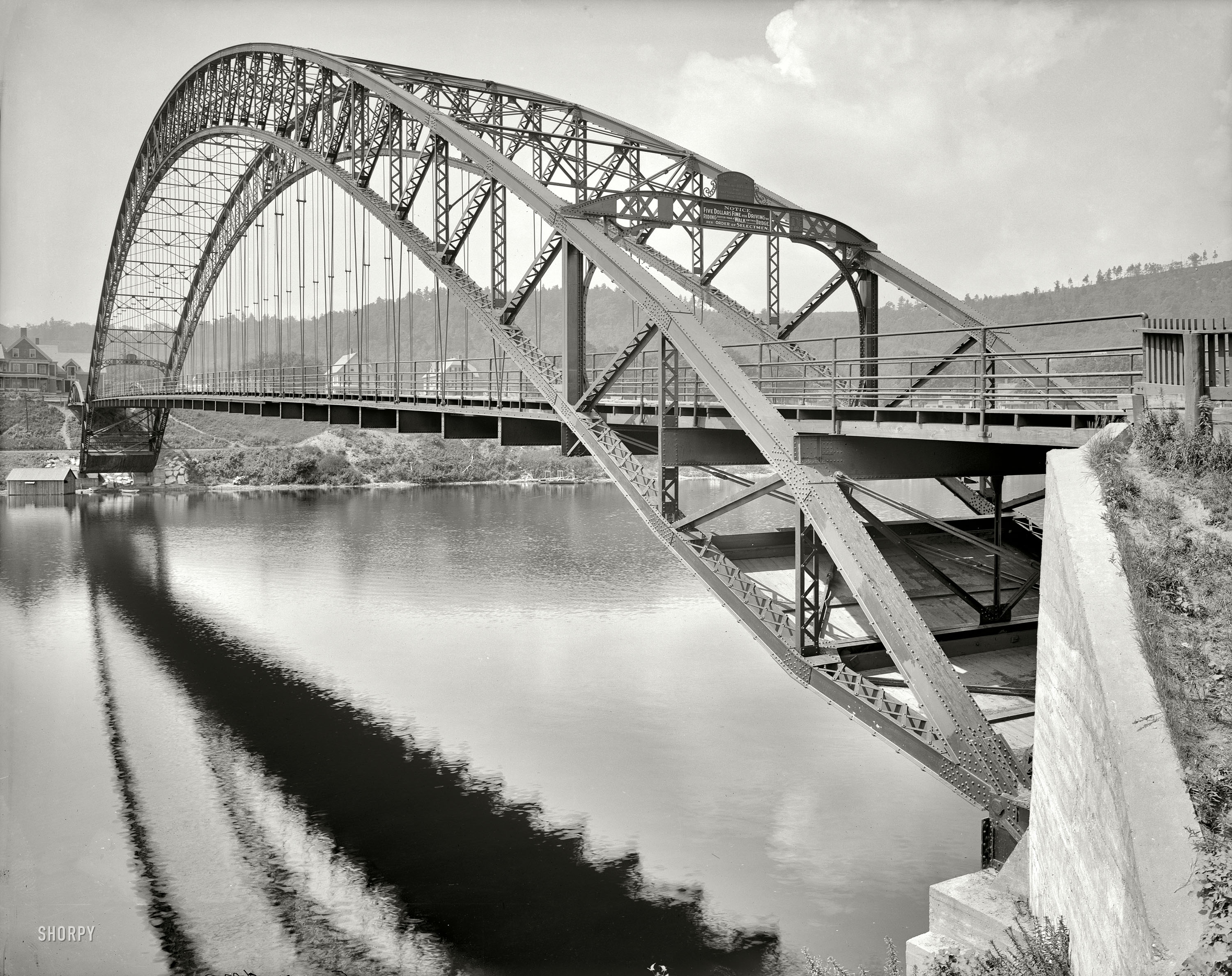 Circa 1908. "Arch bridge, Bellows Falls, Vermont." Note the $5 fine for speeders. 8x10 inch dry plate glass negative, Detroit Publishing Company. View full size.