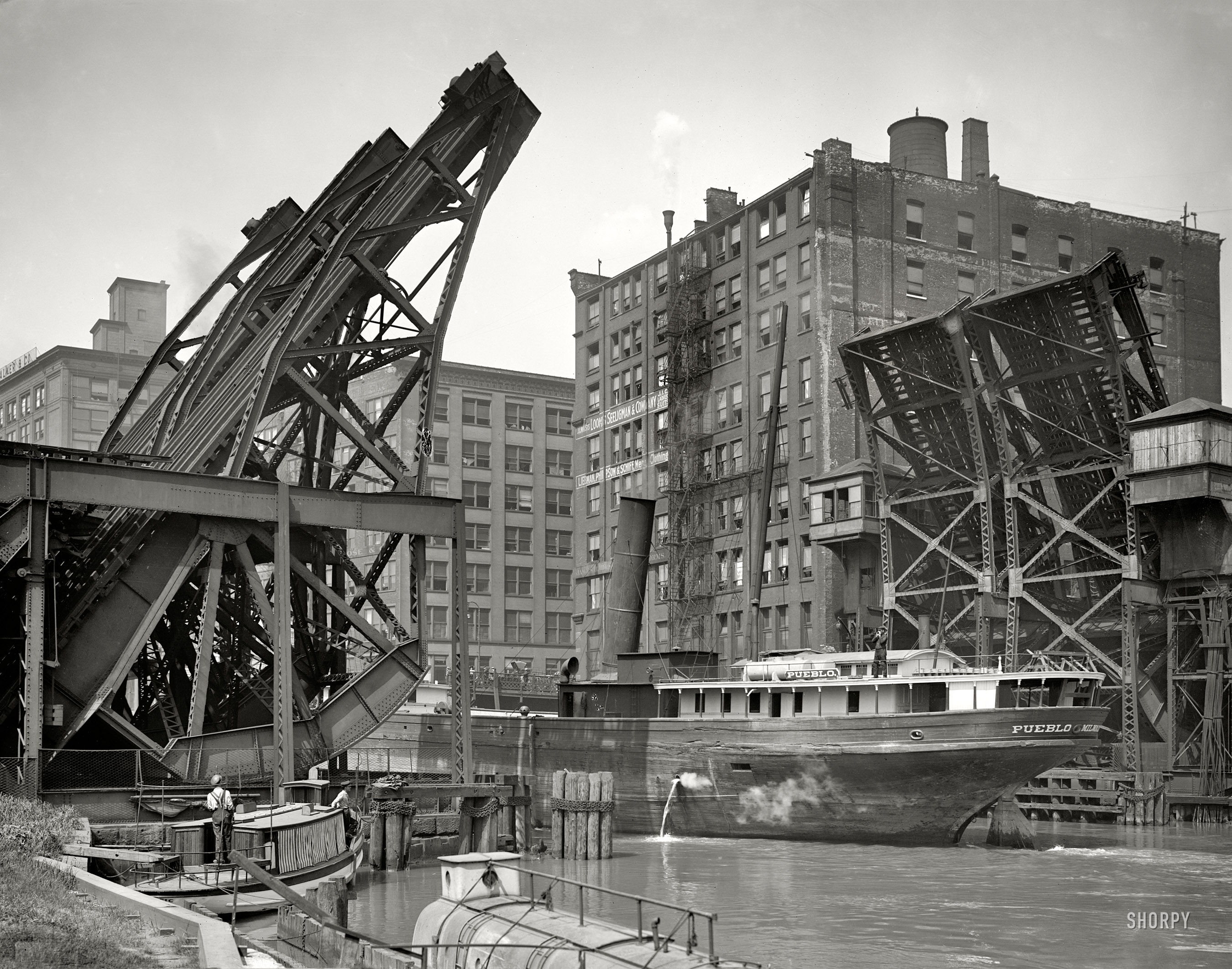 Chicago, Illinois, circa 1907. "Jackknife Bridge, Chicago River." The Pueblo passing through the open span. Glass negative by Hans Behm. View full size.