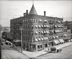 Saginaw, Michigan, circa 1905. "Hotel Vincent." Try our depot shuttle. 8x10 inch dry plate glass negative, Detroit Publishing Company. View full size.
Washington and GermaniaIt appears that (according to the maps and city records) that this hotel stood on the corner of Washington and Germania Avenues. I'm assuming that Germania was changed to Federal due to anti-German sentiment during WWI.
Map showing where the Hotel Vincent Once Stood marked as "1.".
Fire escapesDo those fire escapes have access from a hall, or do you have to break into someone's room to get to one? Given the size of the building, the number of fire escapes reminds me of the lifeboat count on the Titanic.
A Fun Afternoon InvestigationFrom History of Saginaw County we see that the Hotel Vincent was on the corner of Washington and Germania.
Google Maps doesn't show a Germania Street in Saginaw.  According to Saginaw: Labor &amp; Leisure it was changed in WWI to Federal Street.
So at the corners of Federal and Washington we see today on Google Maps the remnants of a little building to the right of the Vincent Hotel with the three windows on the third floor.  From that, here's what the corner looks like today.
View Larger Map
Re:  Fire EscapesAlong with the possible other problems, that last step is a doozy!
French Dry CleaningI thought at first the sign, middle-left, said "French Fry Cleaning"  But what the heck is French Dry Cleaning?
[Dry cleaning, or "French dry cleaning," as it was called, is cleaning without water. - Dave]
(The Gallery, DPC)