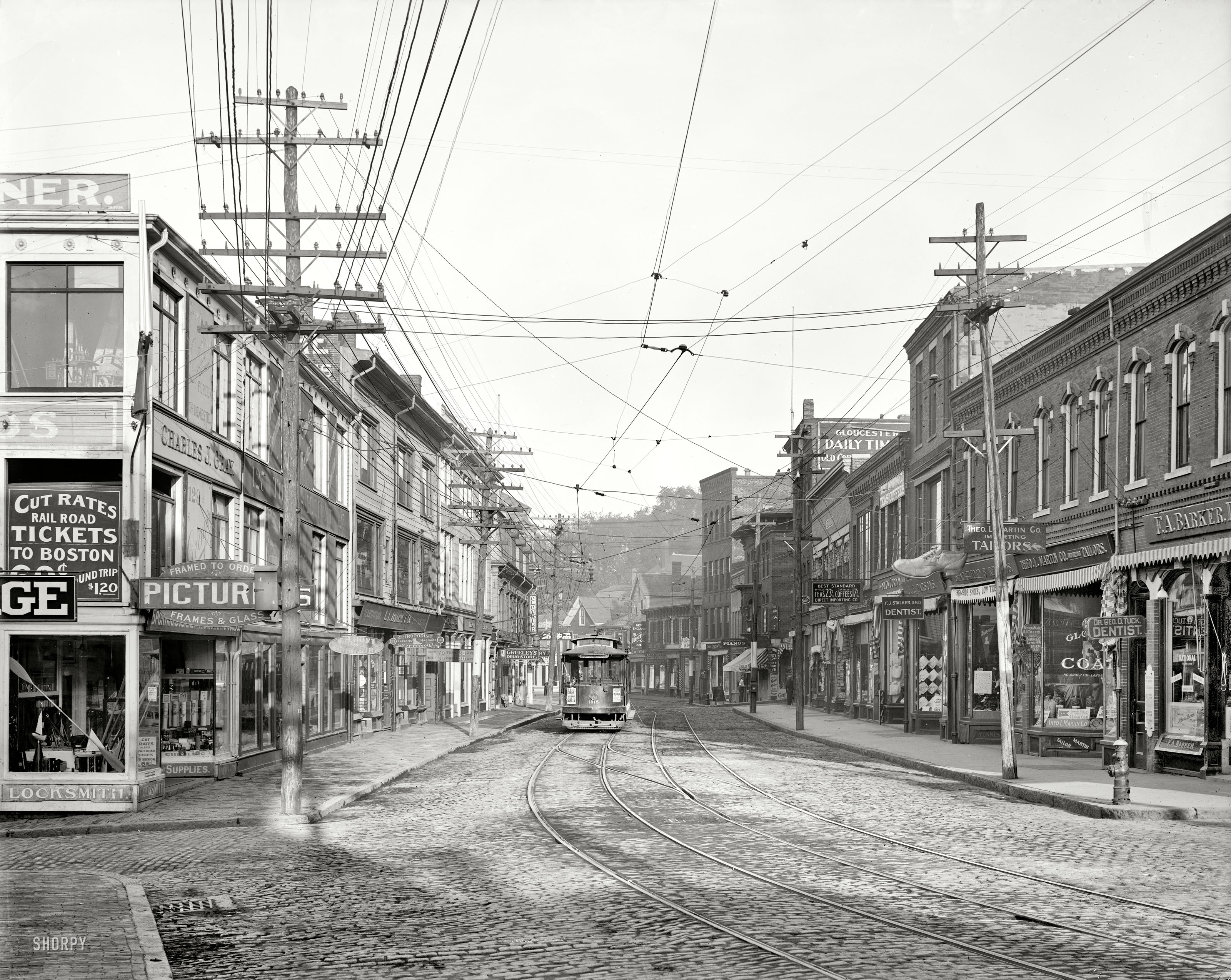 August 1910. "Main Street, Gloucester, Massachusetts." The sidewalks and signage of a century ago. Detroit Publishing Company. View full size.