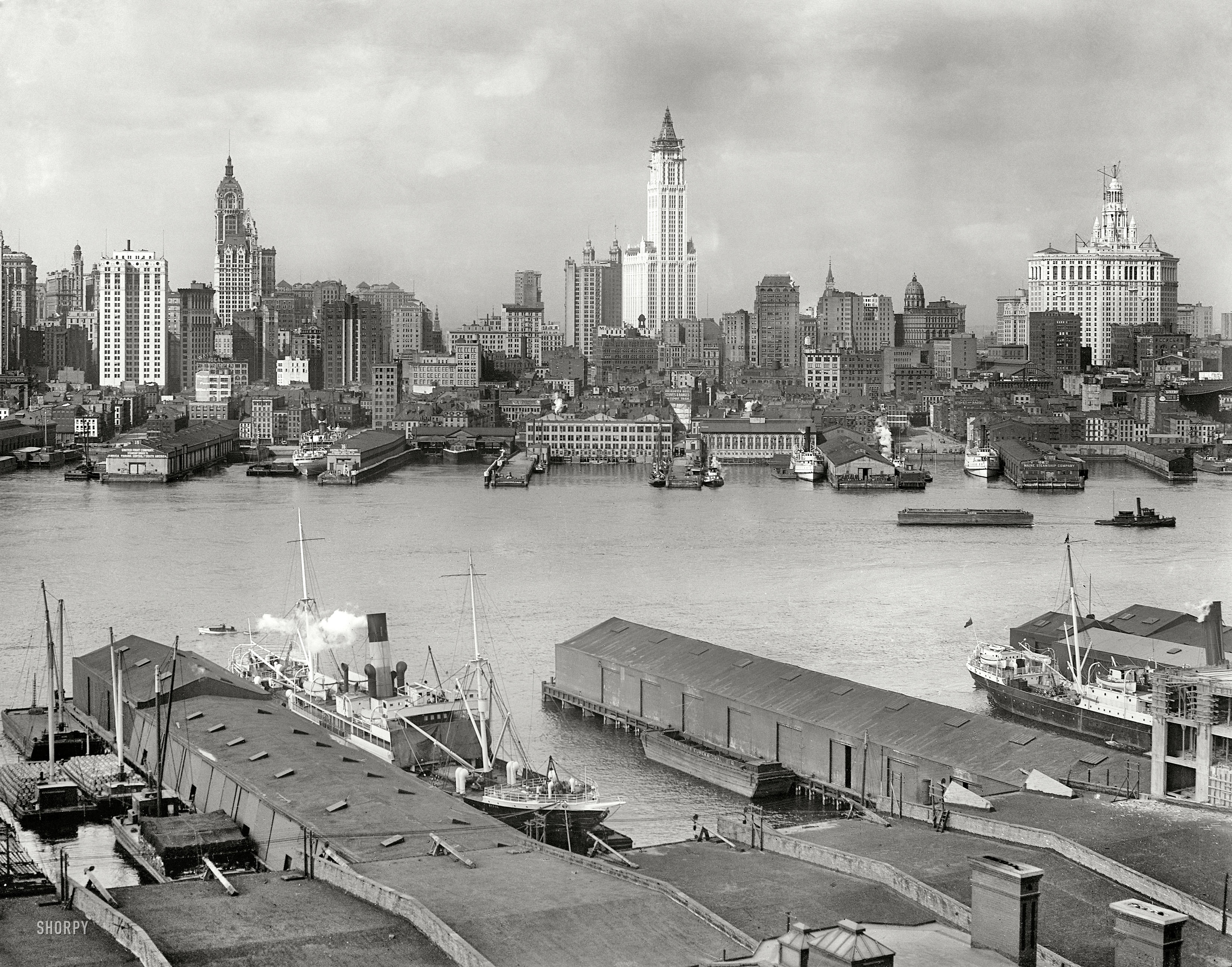 New York circa 1912. "Manhattan skyline from Brooklyn." The Singer Building rises at left along with the Woolworth tower and Municipal Building, both under construction. 8x10 inch glass negative, Detroit Publishing Co. View full size.