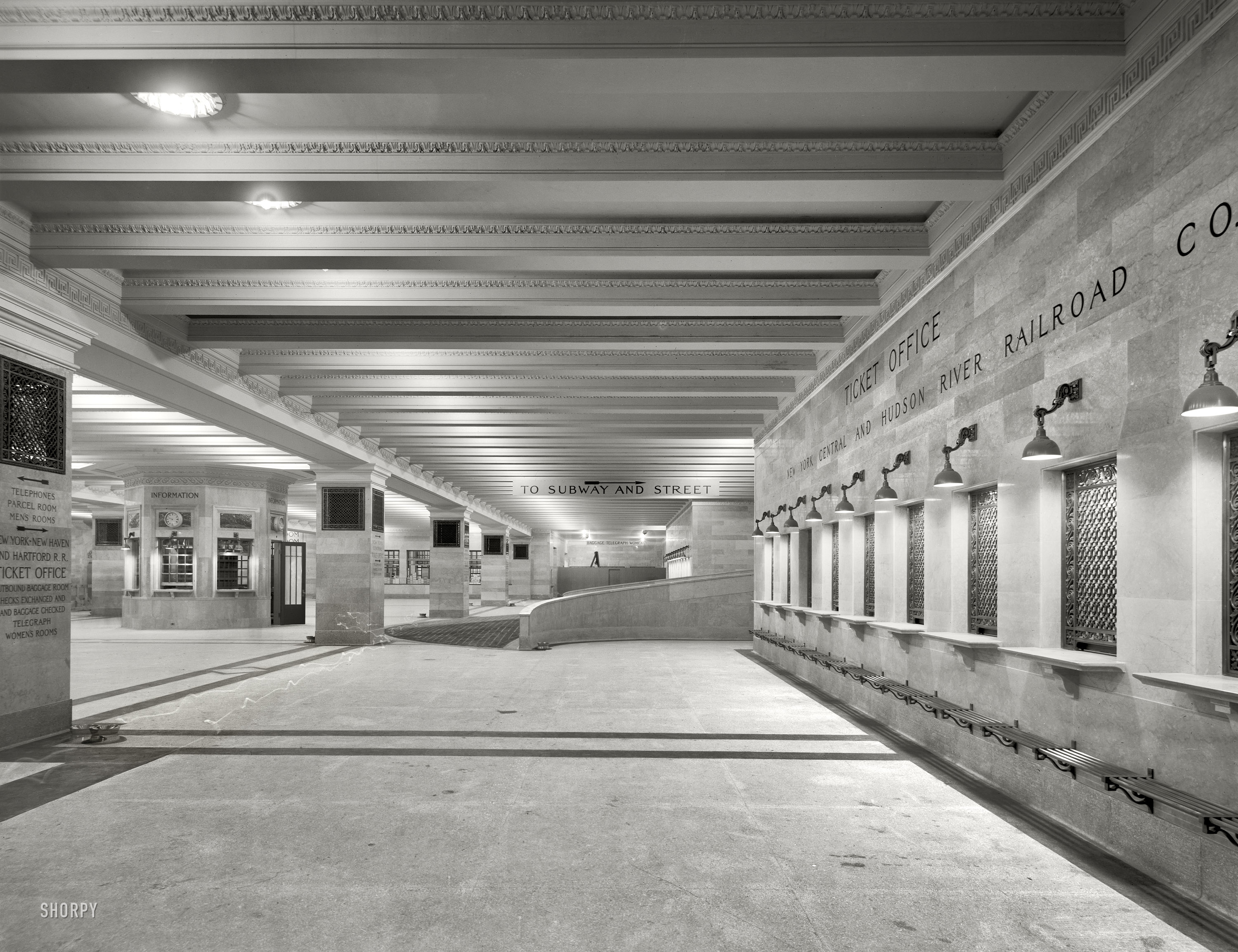 New York circa 1910. "Suburban concourse, Grand Central Terminal, New York Central Railroad." Note the light trail left by a lantern-carrying phantom stroller in this time exposure. 8x10 glass negative, Detroit Publishing Co. View full size.
