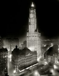 New York noir circa 1913. "The Woolworth Building at night." 8x10 inch dry plate glass negative, Detroit Publishing Company. View full size.
This is, for all intents and purposes, a "new" image for anyone alive today -- a muddy-looking print of it has been available for years in the Library of Congress archive, but it wasn't until last year that the glass negative was imaged and put online. As far as I know this is its Interwebs debut, apart from the LOC website. We did a lot of work to adjust the contrast and get it cleaned up.
Thanks Mr. EdisonThis view would not be as magnificent lit by gas or oil lantern lights.
&quot;To offices on all floors: Please leave all lights on tonight&quot;Apparently the 23rd floor didn't get the memo.
Mullett&#039;s MonstrosityThe Woolworth Building is gorgeous, of course, but this may be the finest picture I've ever seen of Alfred Mullett's City Hall Post Office and Courthouse, along with its dirty loading dock facing City Hall Park. 
I wonder what that structure is crossing the street to the small structure in the park. Pneumatic tubes for sorting, perhaps?
Statuesque BeautyI liken the Woolworth building in this shot to the luminously beautiful girl who arrives at the dance a little late, and everyone stops and stares.
Ethereal.Like a city you are floating towards just as you begin to dream.
Some slackers up thereNote the only dark windows in the whole building.
The Cathedral of CommerceAs beautiful then as it is now.  One of New York's truly gorgeous skyscrapers.  They don't build 'em like that anymore unfortunately.
We&#039;ll leave a light on for youWoolworth must have commissioned the photo and left all (almost all) of the lights on to capture this dramatic sight.  Love it!
That structureI don't think the structure crossing the road has to do with the Post Office. The construction in the corner of the park is for the Broadway subway tunnels (I was able to find information about the history of this construction but have since been unable to find the site... never fails!). Presumably, the pipes carry air or power to the underground facilities under construction. Here's a daytime photo shot from an angle that gives a better view. And here is a history of the park.
Here's an image from the NY Transit Museum's "The Streets Beneath Us". It shows the construction at Murray and Broadway, March 13, 1915, Relocating utility lines for BMT Broadway Subway construction. This would be one block up across the street from the site seen in the above photo.
http://www.flickr.com/photos/newyorktransitmuseum/4703930879/in/set-7215...
Interestingly, this is right across the street from New York's first subway, the Beach Pneumatic Subway, running between Murray and Warren Streets, along Broadway, a distance of... one block.
http://fdelaitre.perso.sfr.fr/Beach.htm
Wow!So atmospheric. A great shot.
The city was quietA slight fog had crept up from the battery to cloak the streets with mist, that was just enough to diffuse the bright lights. Out on the river boats left long thin traceries of light illumining their passages to and fro. 
The tall building stood out from the rest of the city simply by the bright lights on every floor that made it shine in the darkness ...
Imagine it in colorWell, you don't have to. Look at that elegant color combination.  
Great work!Thanks for your efforts, Dave. It is beautiful.
Have Dave, as long as you were tidying the place upcouldn't you turn on the lights?
What&#039;s that pipe?The elevated pipeline running towards the back of the old Post Office?  Anyone know?  
BTW the old Post Office was torn down in the mid-1930s.  Part of the cities preparation for the 1939 NYWF.
Post office tubeAlmost certainly the tube coming out of the post office was part of the extensive pneumatic mail tubing network that was extensively utilized at the turn of the century.  Miles of tubing existed under the city to help expedite mail delivery in the city.
CompetitionEven though this is credited to the Detroit Publishing Company, it's interesting that the photo shows the offices of Irving Underhill Photographer (on Broadway across from the Woolworth Building)who was also known for his cityscapes.
(The Gallery, DPC, NYC)