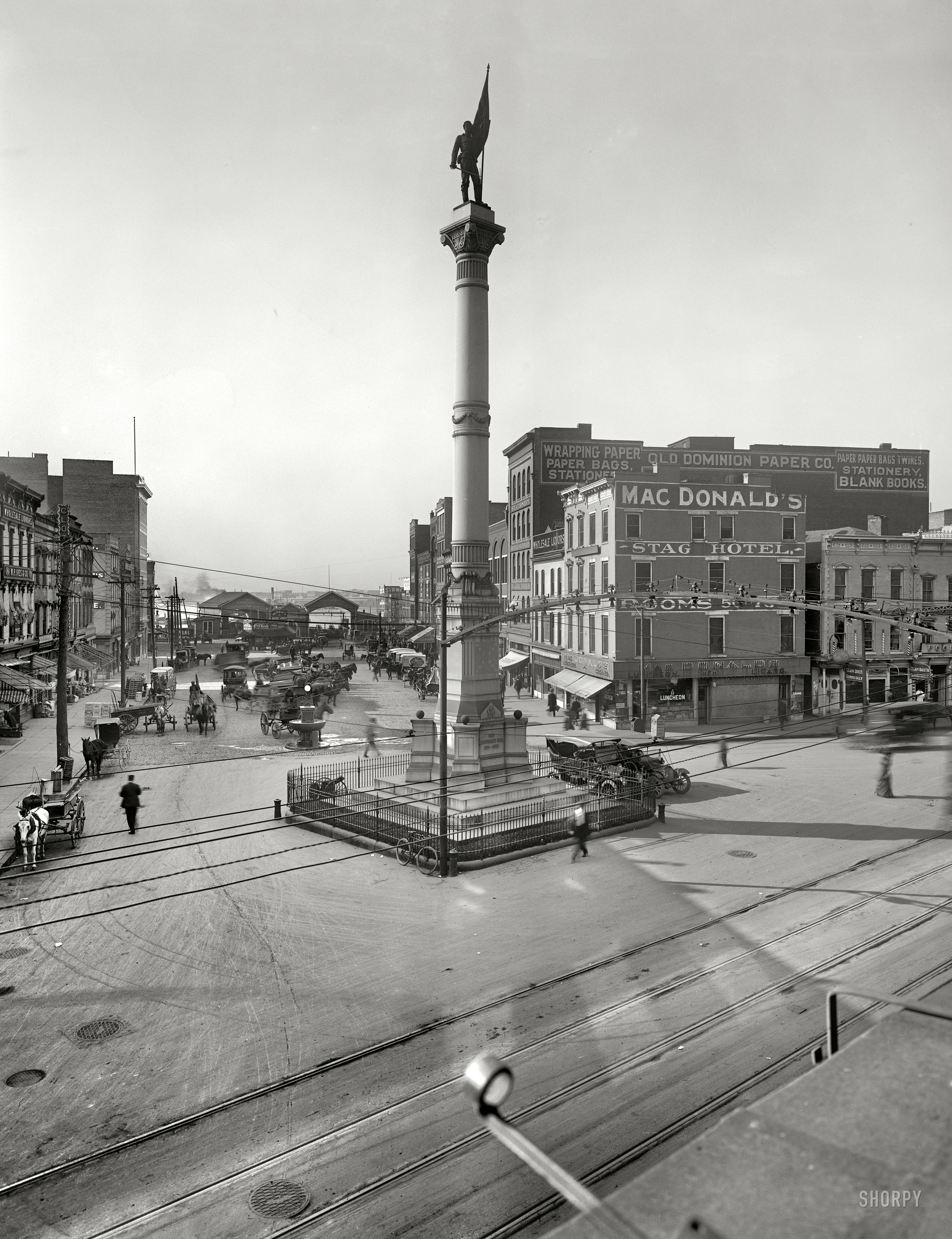 Norfolk, Virginia, circa 1910. "Confederate Monument." Our third look at Norfolk this week reveals another MacDonald's Luncheon & Cigar, as well the Stag Hotel and terminals for the Portsmouth and Berkley ferries. And: Clam Broth Served Daily. Whew! 8x10 inch glass negative, Detroit Publishing Co. View full size.