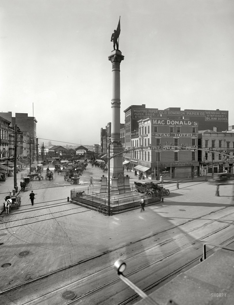 Norfolk, Virginia, circa 1910. "Confederate Monument." Our third look at Norfolk this week reveals another MacDonald's Luncheon &amp; Cigar, as well the Stag Hotel and terminals for the Portsmouth and Berkley ferries. And: Clam Broth Served Daily. Whew! 8x10 inch glass negative, Detroit Publishing Co. View full size.
