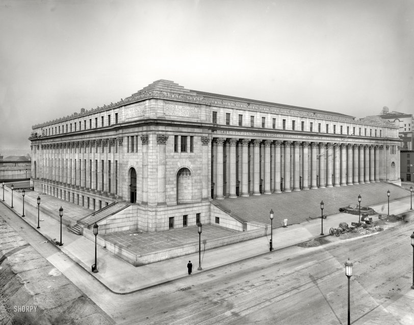 Circa 1912. "Post Office, New York City." Although it looks about a million years old, the Eighth Avenue post office is still under construction in this view. Enlarged in 1934, it's now called the James Farley Building and has the zip code 10001. The famous motto "Neither snow nor rain nor heat nor gloom of night stays these couriers from the swift completion of their appointed rounds" is inscribed on the entablature. 8x10 inch glass negative, Detroit Publishing Co. View full size.
