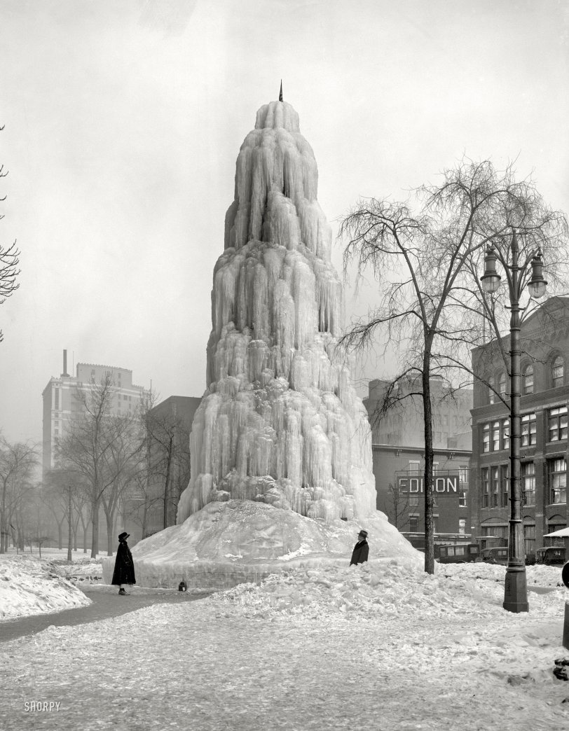 Detroit circa 1917. "Ice fountain, Washington Boulevard." The big icicle with a small request, discreetly stated on that unobtrusive little sign near the man: PLEASE. The rest of the message is up to your imagination. View full size.
