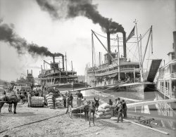 The Mississippi River circa 1906. "Steamboat landing at Vicksburg. Sternwheeler Belle of Calhoun and sidewheeler Belle of the Bends." Our second look at these river packets. Detroit Publishing Company glass negative. View full size.
