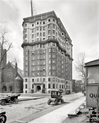 Detroit, Michigan, circa 1914. "Hotel Tuller, Grand Circus Park." 8x10 inch dry plate glass negative, Detroit Publishing Company. View full size.
&quot;Half-ironed pants&quot;More on the Tuller from Forgotten Detroit.
[Also has its own Wikipedia entry. - Dave]
The Ol&#039; Lunch WagonThese antecedents of modern-day diners and catering trucks were common features on the streets of large cities at this time, and were often left at construction sites or in places where lots of people were working late shifts in order to quickly feed the workers there. Here is a picture of a similar "night lunch" wagon on the streets of Detroit, sporting the name of a locally famous hotel that may be familiar to regular Shorpy followers.
Re: Quick LunchSure looks like a diner. Those steps look treacherous. They also look like they could be mass produced.
Right across the street.Is that the corner of a diner on the right? I'd like to see pictures of that.
Windows without glass?In the first level beneath what might be a penthouse, there appear to be several windows without glass or sashes.  Also, is that a church next door?
[The side-hinged casements open in. On the left is the Universalist Church of Our Father. - Dave]
AfterthoughtThat top floor looks like they added it after the building was completed.You can't say they didn't get full use of their site!  Every square inch is occupied!
[The top floors were added in 1914. - Dave]
Here in DetroitTwo 1914 period Detroit Electrics, identified by their stylish curved front corner windows, at home in their city. Is the intriguing "Qui..." on the right some kind of circus wagon?
["Quick Lunch." Grand Circus means "big circle," which was the shape of the park.- Dave]
ElectricLooks like two Baker Electrics in this picture. If I am wrong I am sure there will be an immediate correction. Go for a ride in one with Jay Leno.
(The Gallery, Cars, Trucks, Buses, Detroit Photos, DPC)