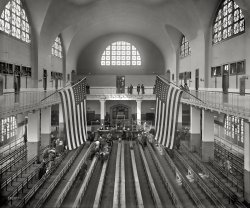 New York circa 1911. "Inspection room, Ellis Island." 8x10 inch dry plate glass negative, Detroit Publishing Company. View full size.
A new beginning, or maybe notImagine what this room must have been like when all those benches were full. Such emotion, such optimism, and likely, such fear. I can only wonder how the immigrants felt who were directed to the door behind the officials on the left.
This Room WasA Cathedral of Hope for so many thousands.
Ellis Island KidsSince all four of my grandparents came to America through the gates at E.I., I took my kids to this sacred place many moons ago.  We toured all the floors, the museums, the infirmary, every inch of it, it was riveting to me.  They have exhibits of authentic luggage and possessions carried overseas, actual clothing that was worn, photographs of many of the immigrants with their personal autobiographies on headphones (if you are curious) and it really puts one back there in time.  One of my young sons could not believe how very poor so many people were, having written that they came with just coins or a few dollars or even nothing in their pockets.  He was totally immersed in the photos and in so many of them, the kids' faces were blurred out to blankness like the child with the lady on the second floor. Anyway, at one point my tearful son said "This boy is so poor, he doesn't even have a face."  It took us a minute before we 'got it' but has provided much laughter in the retelling; maybe you had to be there.  I'm grateful every day that my ancestors' decision to become Americans was a priceless blessing for all their descendants.  Ellis Island is unforgettable.  God bless America.
DetainedMy grandmother was detained (coming in from Poland) due to an eye infection. Her two younger siblings and mother waited for three days with relatives in new York. Once Grandma was released they left to settle in Chicago.
Stairway to HeavenI made a special trip to New York from Colorado just to see Ellis Island. It was one of the most moving places I have been as both sides of my family passed through there. My favorite spot was the stairs leading out after you passed inspection and were granted entrance to America. They're about 15 feet wide and you can see and walk in the indentations made by the millions of feet that have worn down the steps. I couldn't help but think of my grandparents who walked down the same stairs. 
It was worth every penny spent to restore Ellis Island. And I recently heard from a friend who's a project manager for the National Parks Department that the other buildings at Ellis Island will begin restoration soon.
My GrandmotherMy grandmother arrived at Ellis Island as a young woman (12 or 13) after traveling by ship from Greece with her father. The mother she barely knew met them there and on the ferry back to NYC, threw my grandmother's precious belongings into the river and told her she was in America now and would start over. That story used to break my heart when I was a girl; I guess it still does.
My family and I visited a few years ago and it really does feel like a sacred space. Like OTY here, I am so thankful my grandparents left their Greek villages and became Americans.
Mine tooMy grandmother came through Ellis Island with her parents and siblings.  My father and his family came from Eastern Europe via Canada to the USA.  It's worth noting in these present times that my family and millions like them waited in line and came to the USA legally. Everyone who does otherwise, regardless of the country from which they come, disrespects the sacrifices made by millions of honest immigrants from around the world.
RootsBoth my parents were immigrants. My father, his mother and three siblings came through Ellis Island in 1922. I was able to find them on the Ellis Island Web Site. My mother's family came here in 1923. Eastern European immigration just about ended in 1924 because of the so called "Red Scare" laws. Interestingly , I found my Mother's mother (my grandmother) and my mother's 2 younger sisters and her only brother on the Website but not my mother, an older sister or my grandfather. They left Southampton, England in 1923 but don't appear on any Ellis Island records. My mother lived 103 years and I could hold a conversation with her up to about a year before her passing. She always insisted that she came into "Castle Gardens" but Castle Garden stopped receiving immigrants in 1892 and turned the job over to Ellis Island. I sort of believe she may have come in to Boston or Philadelphia but just didn't remember. Every so often I start searching for the records again but with no tangible results. In any case  I'm one grateful guy. They endured enormous hardships to get here and they just made it. God Bless America.
+99Same view from August of 2009.
When I immigratedForty-seven years later, I arrived at Idlewild (now JFK) on Pan Am (now extinct) with $75 in my pocket (now spent). It was certainly a more pleasant way to begin the new life, but the excitement felt by the Ellis Island immigrants could not have been any higher than mine.
How do you do it?timeandagain, have you simply been visiting the sites in the LOC photos and reshooting them or are you n cahoots with Dave and know a couple years in advance what he's going to post?
Plaster JobLooking at the post +99 from timeandagainphoto and one that I took when there this summer, it looks like they plastered over all of the block walls and tile ceilings in that building. Unless they added that in the restoration--which would seem strange.
Lost And FoundSeeing that lone bag on a bench makes me wonder if they had a lost and found.  If so, the abandoned/lost bags might be part of the exhibits mentioned in another comment, with their own tales to tell.
WartimeWhen the US entered the First World War, Ellis Island became the mobilization centre for Red Cross Nurses heading overseas.
My ex-husband's grandmother. Charlotte Edith Anderson was the first Canadian Indian to be trained as a nurse, though no hospital in Canada would train her. She trained at the New Rochelle Hospital. Edith (as she preferred to be called, wrote in her wartime diary about her arrival at Ellis Island from New Rochelle where she had been working as a Public Health nurse, visiting New York City before heading overseas and her departure.
I was pleased to have transcribed her wartime diary but sad that I didn't get a copy before my husband and I divorced.
https://www.shorpy.com/node/7764
Re: How do you do it?I've been doing comparative shots of identical views since the mid-1980s.  When I moved to DC almost 20 years ago I started using the photographs from the collections of the Library of Congress (they were only available in physical files at the library then).  I research specific cities and place them in separate files along with maps where the shots were taken.  When I visit those cities, I take the appropriate files with me and take current shots from the same perspective.  I have hundreds of sets and thousands of shots of cities throughout the country in several lateral files as well as on several gigs of computer memory.  Drives my wife insane.
Ocean Border, Land BorderI'll bet that if there had been a land border between Europe and the United States, a lot of European immigrants would have slipped across, too.  The sacrifice was in taking the risk and the leap of faith to come here.  I'll also bet that many immigrants without documentation would gladly become citizens today. To my mind they should be given the chance.
Guastavino Tile CeilingJuly 1916, an explosion occurred on Black Tom Island, a loading facility just a few hundred yards off Ellis Island.
The blast caused $400,000 in structural damage. As part of the repairs, the Guastavino Brothers installed a new tile ceiling over the Great Hall.
Dad DetainedMy father came through Ellis Island in 1920  with his father, mother and two younger sisters.  They came from Greece. He was a boy of 8 and he had some sores on his head.  He had to be detained. They wrapped adhesive tape on his head.  If you remember the old adhesive tape,if you didn't have sores before they put it on your head, you certainly would have sores afterward.  They also changed his first name from Evstrathios to Charles.  He was very proud of his heritage and he was glad they made a monument out of Ellis Island.
Isle of TearsListening to Irish Radio, couldn't help thinking back to this photo.
Guastavino Tile  Paul39 mentioned the repair after the nearby explosion.  That answers my question of how they made plaster adhere to the glazed tiles that I saw when I visited a few years ago.  The original substrate was probably terra cotta.
  The oyster bar under Grand Central Terminal has a wonderful example of Guastavino tile ceiling which is hard to find now.
Grandma on the LusitaniaMy grandparents on my father's side came through Ellis Island from Russia. My grandfather arrived sometime in the final decade of the 19th century, and just this evening, after seeing this post, I have done a search at  ellisisland.org on my grandmother (who I have more information about), and may have discovered documentation of her arrival on the ship's manifest!
Thank you, Dave and Shorpy, for pointing me in this direction! I have contacted a cousin who hopefully will be able to verify or discount my findings. Here is an image of the manifest which has me so excited. Please scroll down to Line 14.

Finding relativesThis is a wonderful photo, and I can easily imaging my grandparents sitting there as children around 1904-1906.
Mr. Mel, frequently immigrant names were not spelled as we think they should've been.  You may want to try searching the Ellis Island database via a different search engine: http://stephenmorse.org/  (first item on the page).  Mr. Morse, the inventor of the 8086 computer chip, created this site soon after the original EIDB went public, because their own search engine was so pitiful.  He has since improved it.  It will enable you to search by sounds-like, just the first letter, and more.  There are FAQs to help use the search engines. (I highly recommend many of the other search engines on that page - amazing!)
CSK, congratulations!  But there's a whole second page to your passenger list, which will have even more information.  So go back to where you found your page, and click on "Next" or "Previous" (sometimes the original microfilms were rolled backwards on the reels).
beachgirl2, it was very rare that officials at Ellis Island changed names, this is mostly a myth.  They had to match the names to the departure lists created in "the old country", and there were plenty of translators for the languages brought over.  (These departure lists still exist for Hamburg and some ports in England)  But sometimes a recent immigrant wrote back home, and told them to use his new name, now that he was American.  Or they Americanized them soon after arrival, to blend in.  Or a schoolteacher couldn't pronounce the birth name. ...  So if you research, you should be able to figure out when your father changed his name - before he left Greece, or very soon after the family arrived.  But probably not on Ellis Island.
Great photo - and new version too!
Explosive AlterationsI was told by an archaeologist who works at Ellis that most of the interior (including the ceiling and walls) had to be redone after the building suffered blast damage from the Black Tom explosion of 1916.
A website for Jersey City history notes that: "the Statue of Liberty sustained $100,000 in damages from the spray of shrapnel, and newly-arrived immigrants at Ellis Island had to be evacuated for processing at the Immigration Bureau at the Battery in New York City."
Also, the buff-colored "stone" of the walls in the current photos is actually plaster with incised and painted joints (an accurate restoration of what had existed following the Black Tom incident, or so I am told).
(The Gallery, DPC, NYC)