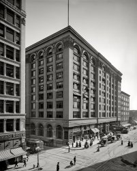 Circa 1910. "American Express Co., Main and Sixth." Just steps away from the Aseptic Barber Shop. Who can tell us what city we're in? View full size.