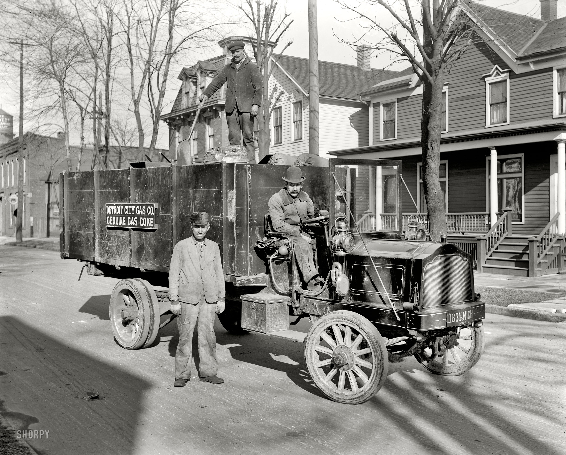 Circa 1912. "Coke delivery wagon and workers, Detroit City Gas Co." Our second look at these grimy gents and their battered Packard truck. View full size.
