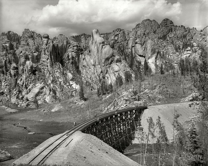 Colorado circa 1901. "Cathedral Park near Clyde. Colorado Springs &amp; Cripple Creek Short Line." A gray day in the Rockies. 8x10 inch glass transparency by William Henry Jackson, Detroit Publishing Company. View full size.
