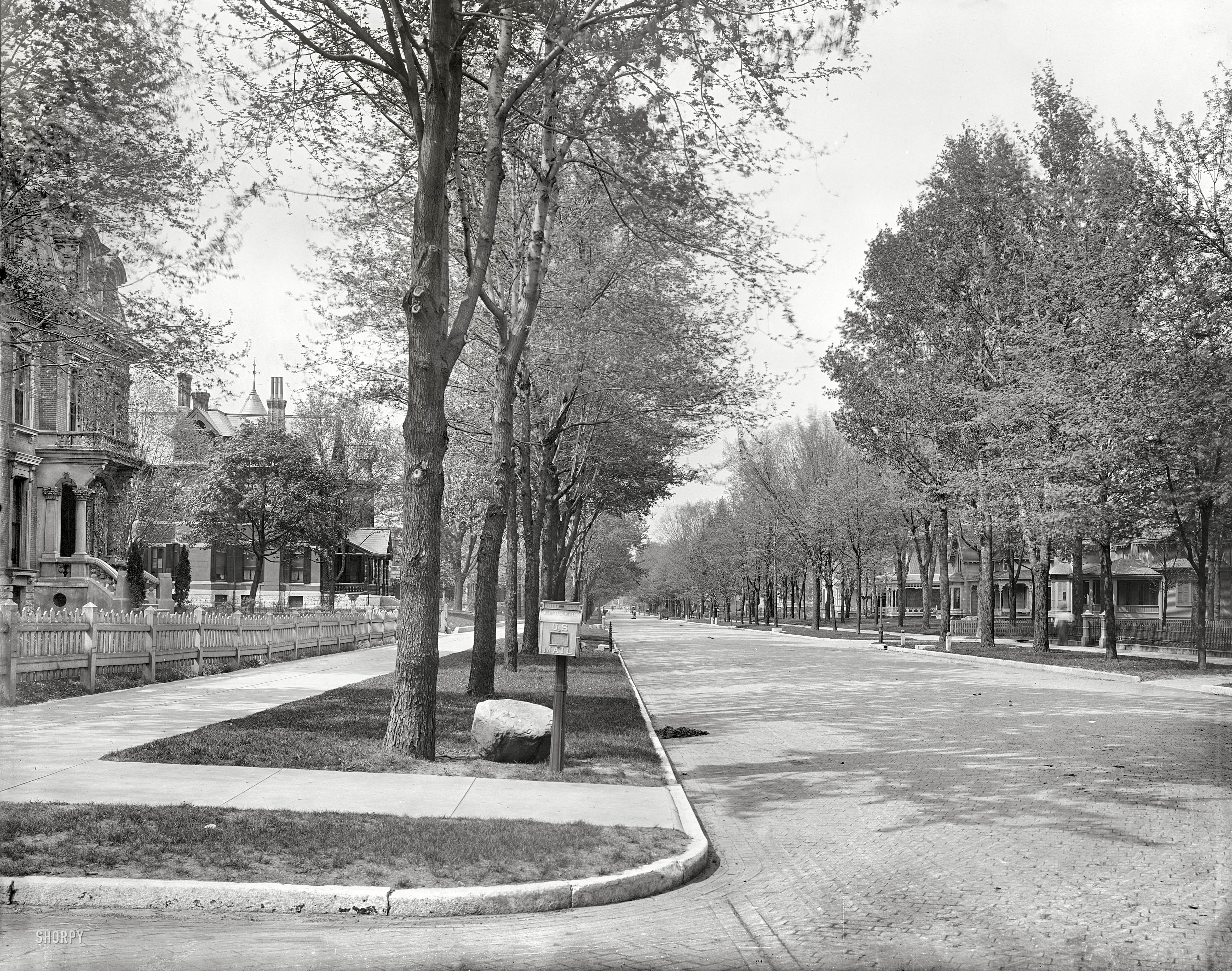 Indianapolis, Indiana, circa 1904. "North Delaware Street." A block east of our previous Indy view, this leafy residential street is furnished with a mailbox and mounting blocks as well as hitching posts; one block bears the house number 656. Detroit Publishing Company, 8x10 inch glass transparency. View full size.