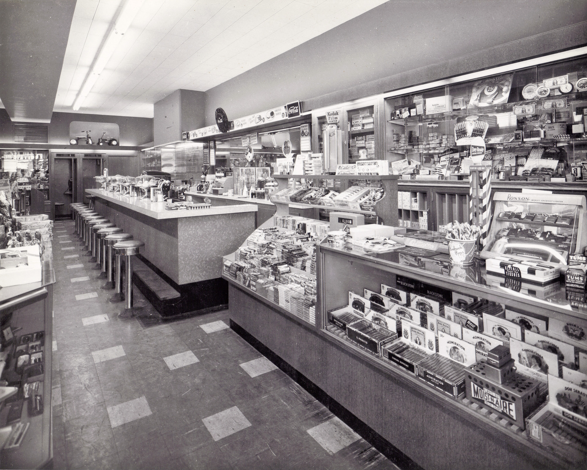 Early 1950s lunch counter somewhere in northern New Jersey that sold candy, cigars, small gifts and toys. View full size.
