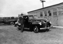 My grandfather, William Rennie, with his automobile, in Worcester, Massachusetts, circa 1940. View full size.
Grandpa&#039;s car ID1940 Dodge.
Re: Grandpa&#039;s carThanks!  I love the curvy lines.  My grandfather loved cars, but didn't have much money, so I don't know if he bought this car years later, used.  All I remember my mother saying about this picture was that he loved this car.  I wish I had asked more questions about these old pictures when I had the chance!   
(ShorpyBlog, Member Gallery)