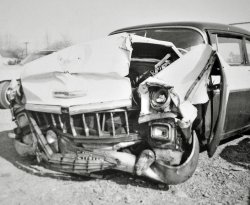 I was in the back seat when we wrecked.  A T-bird blew a red light and we T-boned them.  My grandpa broke all his ribs, my Dad snapped his arm off at the shoulder.  My brother and I flew into the back of the front seats and ripped the skin off our knees.  We were going about 45 or so.  It was a scary experience.  I still remember most of the details of that day.  It was a cold November day in 1964 in Kent Ohio. View full size.
Whoa!My only childhood crash involved me gouging my brother's head with my teeth as Mom rear-ended somebody at a relatively slow speed. I was standing on the hump in the back, my brother was in the middle up front.
That could&#039;ve been me!Oh my, that Chevy looks just like the 1956 210 4-door 6- cylinder (no "V" on the hood) my Dad had when I was a kid and the car in which I learned to drive at age 11 - with "three on the tree".
I remember many summer road trips in the late 1950s, when we travelled hundreds of miles to our camping destination on two-lane blacktop. I often stood on the rear seat, leaning over the front seatbacks, watching the world roll by.
Safety standards sure have changed, for the better.
(ShorpyBlog, Member Gallery)