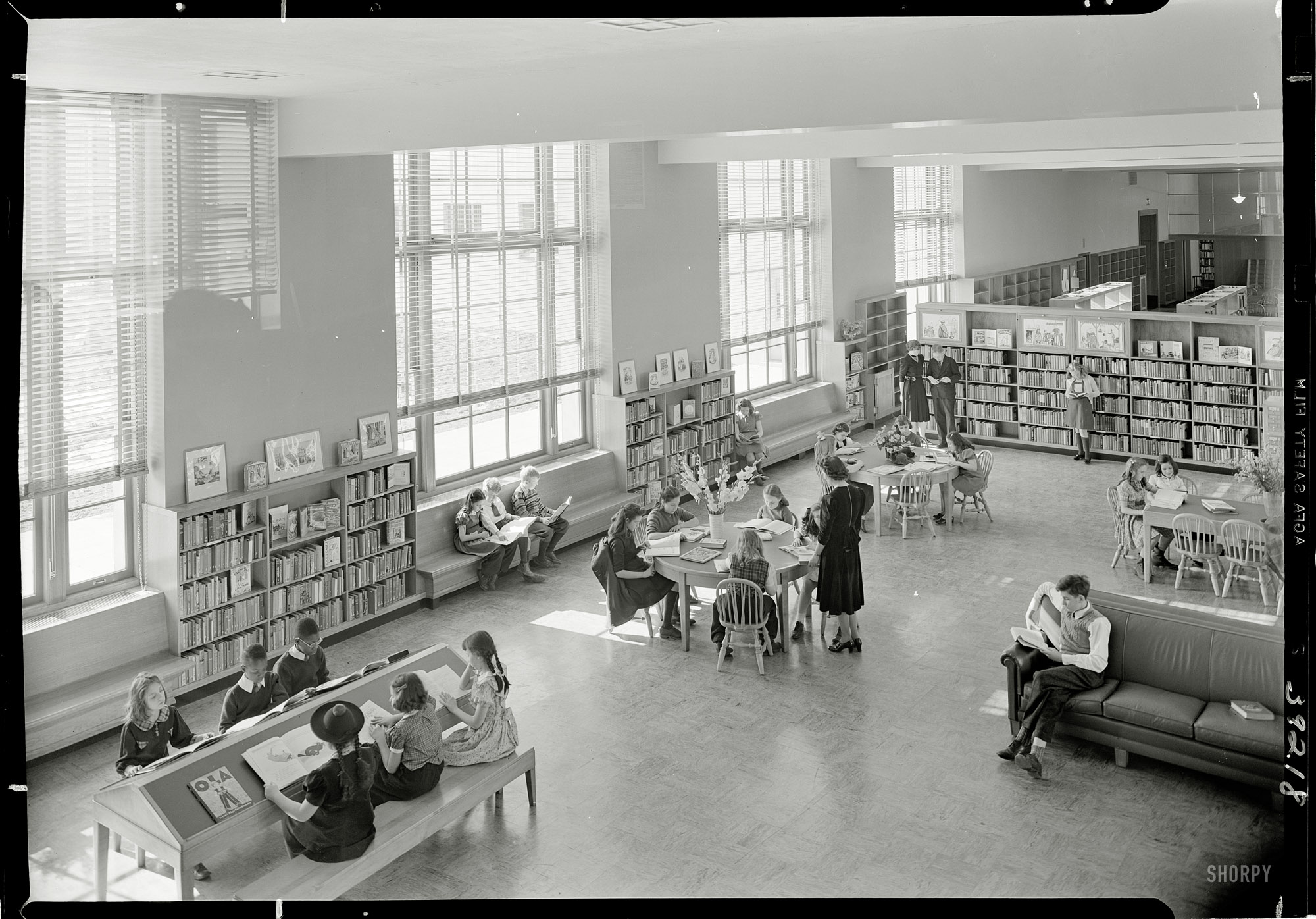 February 1, 1941. "Brooklyn Public Library, Prospect Park Plaza. Children's Room, from balcony." 5x7 safety negative by Gottscho-Schleisner. View full size.