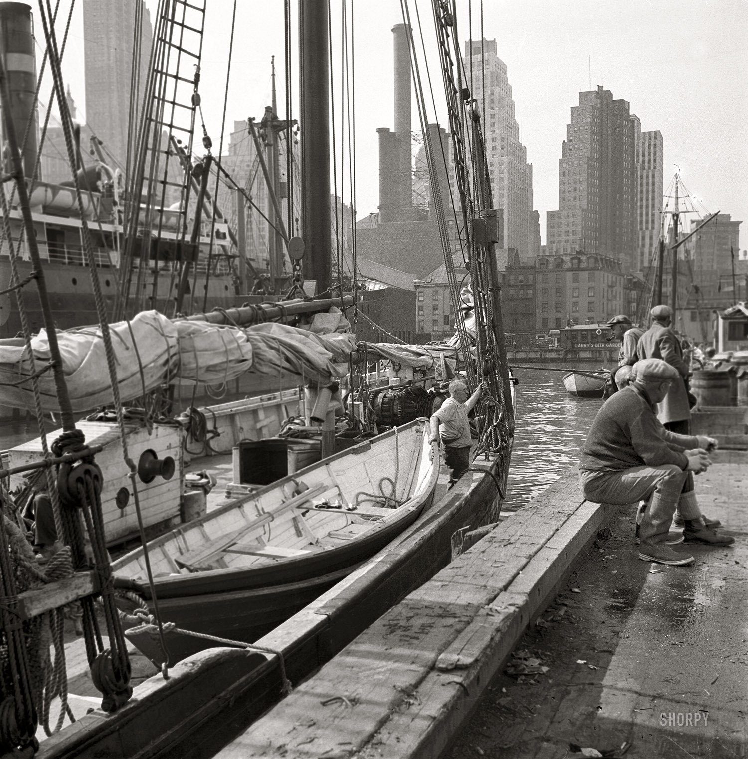 April 20, 1934. "New York. Fulton Market pier, view to Manhattan over East River." 4x5 inch nitrate negative by Gottscho-Schleisner. View full size.
