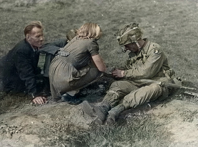 101st airborne paratrooper with civilians in the fields near Sint Oedenrode, Netherlands. One of a set old pictures of my hometown I colorized. The full set is on Flickr. View full size.