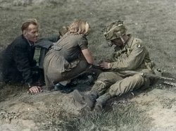 101st airborne paratrooper with civilians in the fields near Sint Oedenrode, Netherlands. One of a set old pictures of my hometown I colorized. The full set is on Flickr. View full size.
