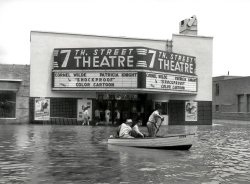 This was taken during a flood in 1949 in front of the 7th Street Theatre in Fort Worth Texas, on the corner of 7th Street and University, known locally as "Six Points". Photo by Lee Angle. I used to work for Lee in the 80s, and he gave me this negative and many others he was throwing out during one of his many clean-and-toss sessions. I always thought it was a fantastic photo, so I thought that I'd share it. View full size.