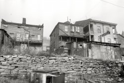 December 1935. "Hamilton County, Ohio. Cincinnati slum dwellings." Close-up of the houses seen in yesterday's post. Note the railcar in the background. 35mm negative by Carl Mydans for the Resettlement Administration. View full size.