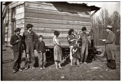 March 1936. "Resettlement Administration official investigating the case of nine living in field on U.S. Route 70 between Camden and Bruceton, Tennessee, near the Tennessee River." View full size. Photograph by Carl Mydans.