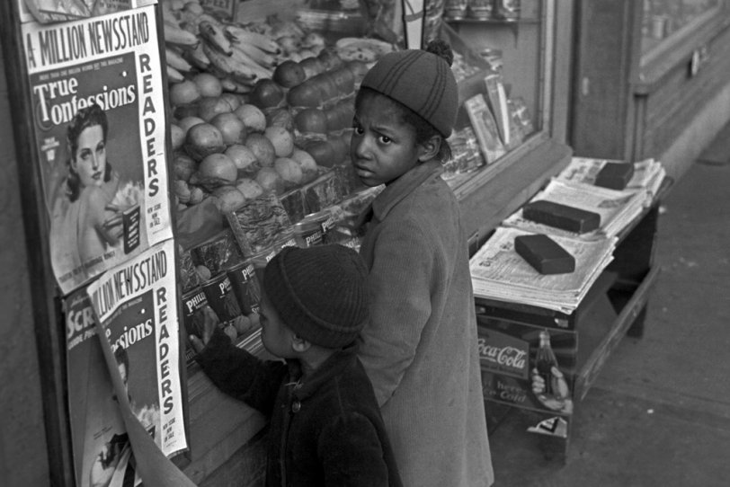 Photo of: A Million Newsstand Readers: 1937 -- Children browse a street market in Washington, D.C. Photograph by John Vachon, November, 1937. View full size.