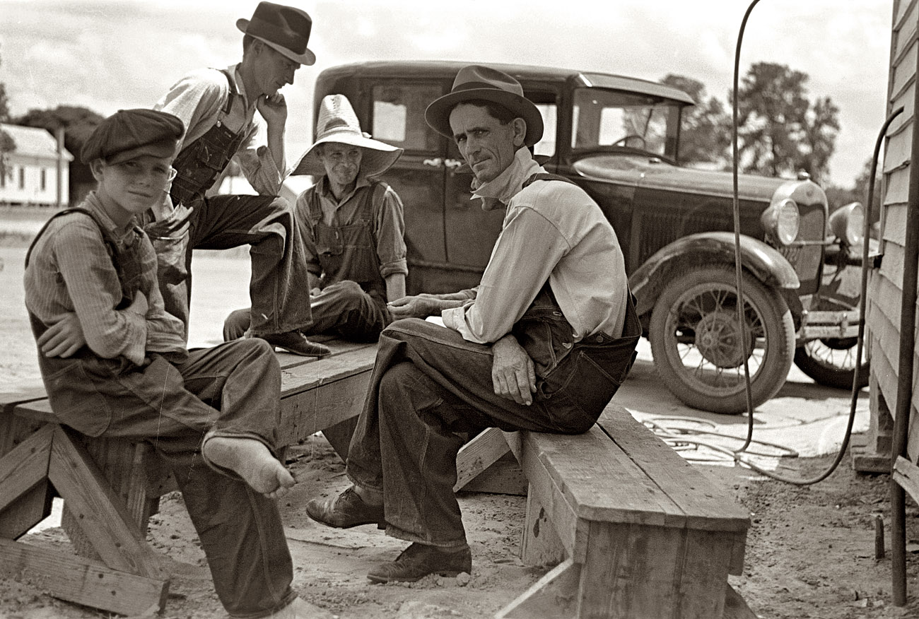 May 1938. Bench warmers at the cooperative store in Irwinville Farms, Georgia. View full size. 35mm nitrate negative by John Vachon for the Farm Security Administration. We met two of these characters in earlier posts.