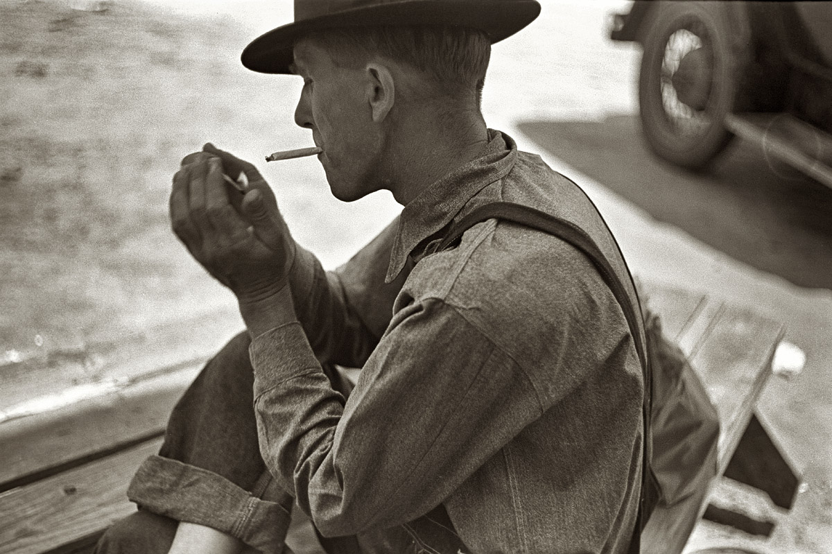 May 1938. Passing the time outside a crossroads store in Irwinville Farms, Georgia. View full size. 35mm nitrate negative by John Vachon for the FSA.