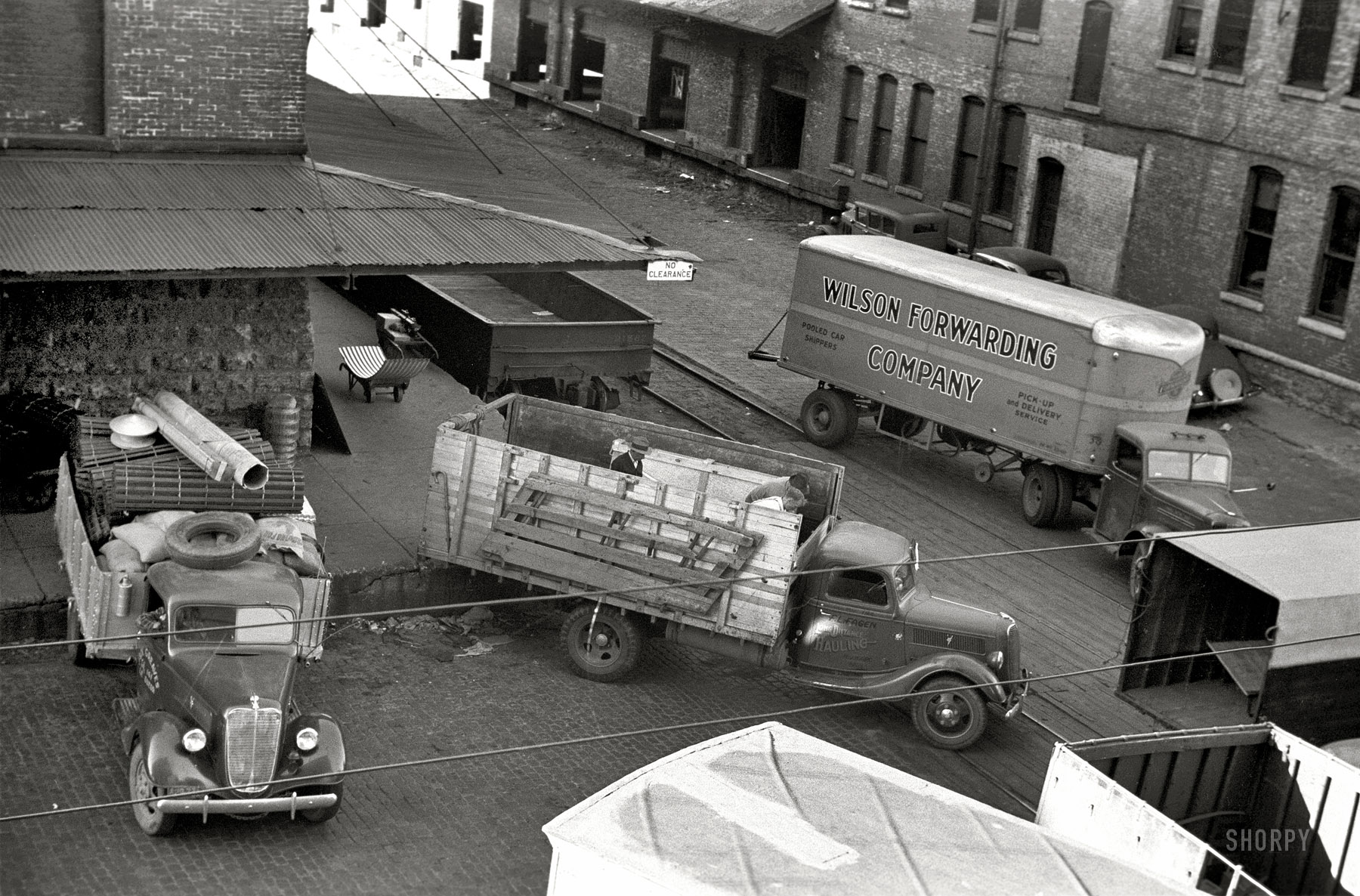 September 1939. "Minneapolis, Minnesota. Trucks loading at farm implement warehouse." Another behind-the-scenes look at Twin Cities trucking. 35mm nitrate negative by John Vachon. View full size.