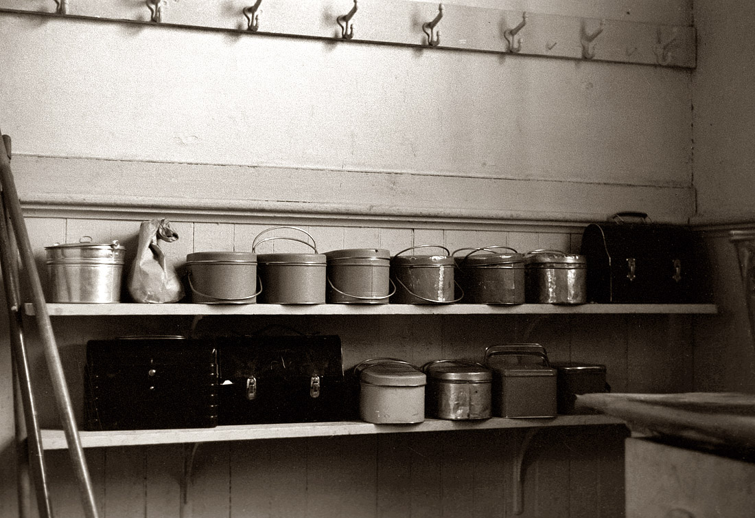 September 1939. Children's lunch pails wait for their owners in a rural Wisconsin schoolhouse. View full size. Photograph by John Vachon.