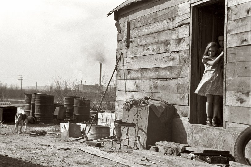 Photo of: Shacktown: 1940 -- April 1940. Shacktown in Dubuque, Iowa. Many residents keep a cow or a few chickens.  View full size. 35mm nitrate negative by John Vachon for the FSA.