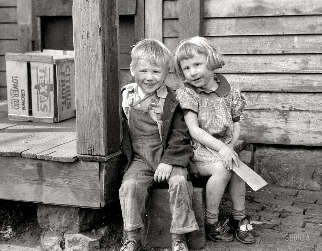 April 1940. Dubuque, Iowa. "Children who live in the slums." Our second look at this towheaded twosome, a sort of proto-Opie and his sister. 35mm nitrate negative by John Vachon for the Farm Security Administration. View full size.