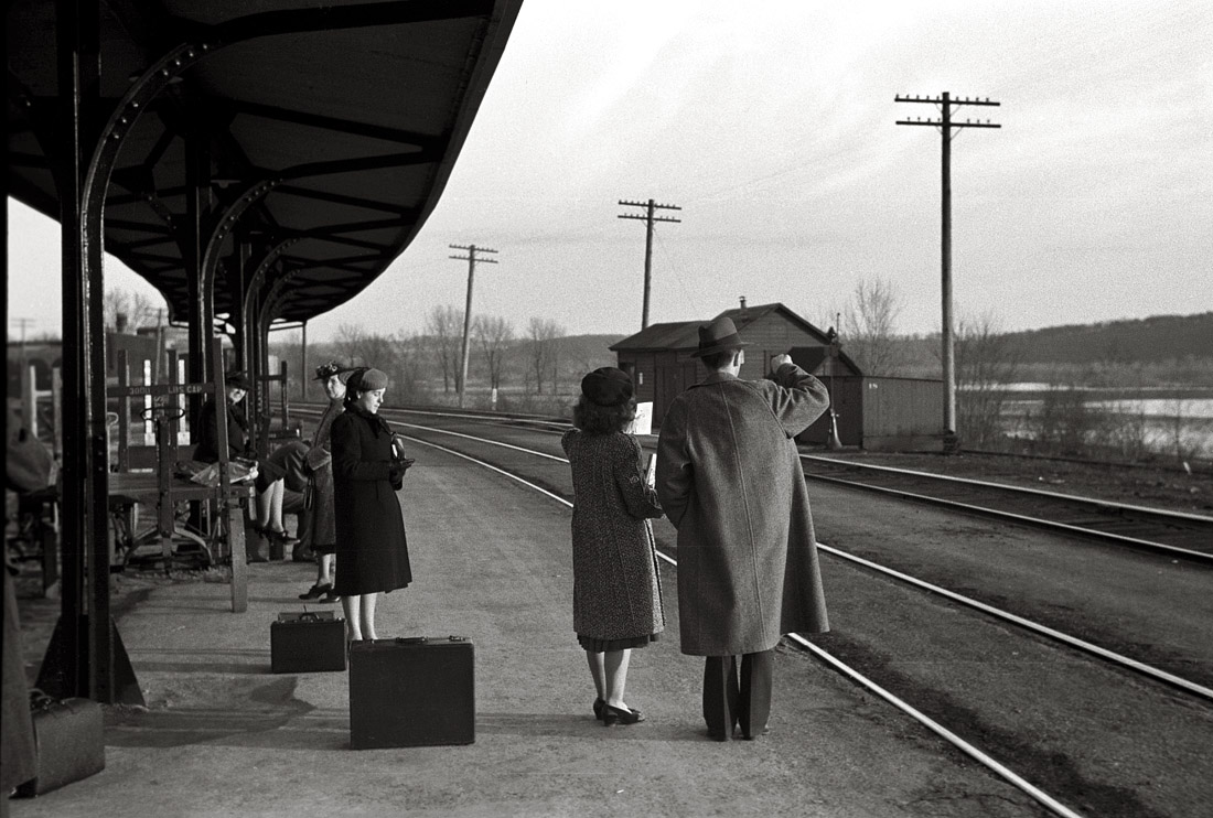 April 1940. East Dubuque, Illinois. "Waiting for the train to Minneapolis." 35mm negative by John Vachon for the Farm Security Administration. View full size.
