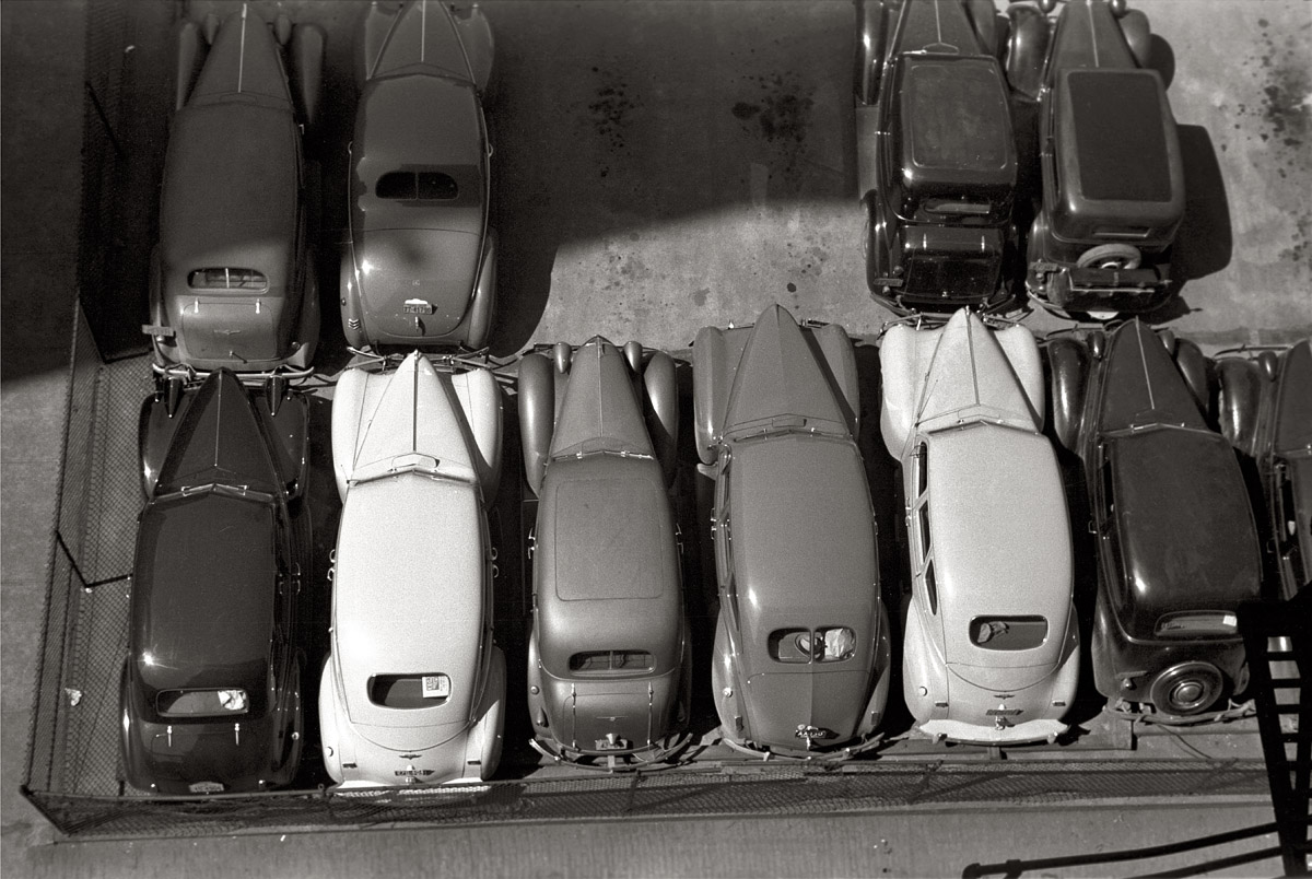 May 1940. Parked cars in Des Moines, Iowa. View full size. 35mm nitrate negative by John Vachon for the Farm Security Administration.