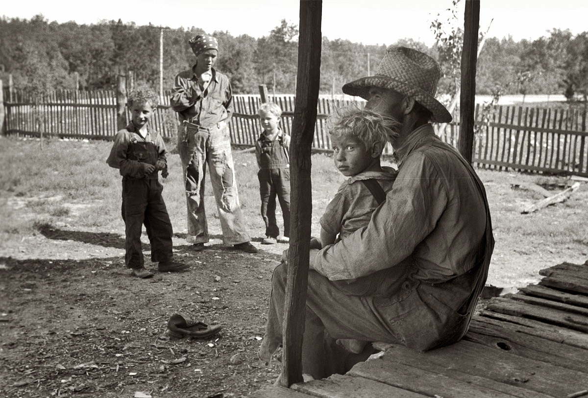 Missouri, May 1940. "Ozark farmer and family." View full size. 35mm nitrate negative by John Vachon for the Farm Security Administration.