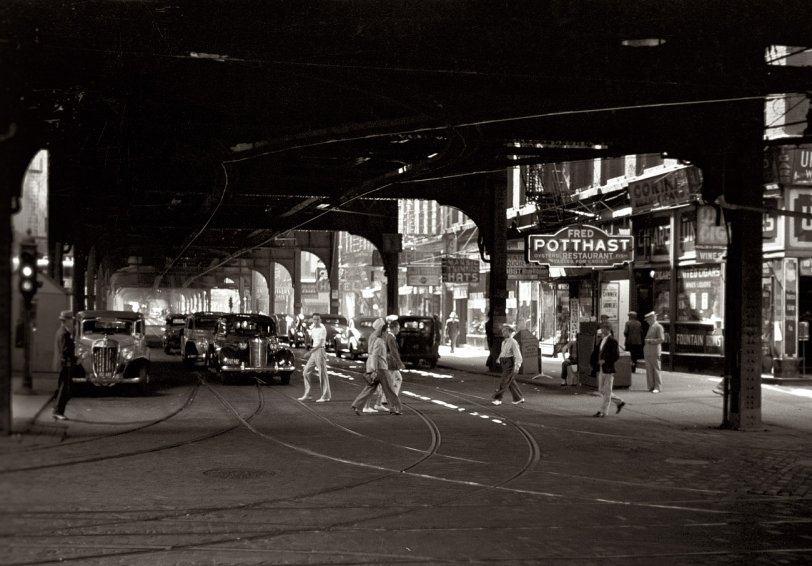 July 1940. Another view under the elevated tracks in Chicago. View full size. 35mm nitrate negative by John Vachon for the Farm Security Administration.
