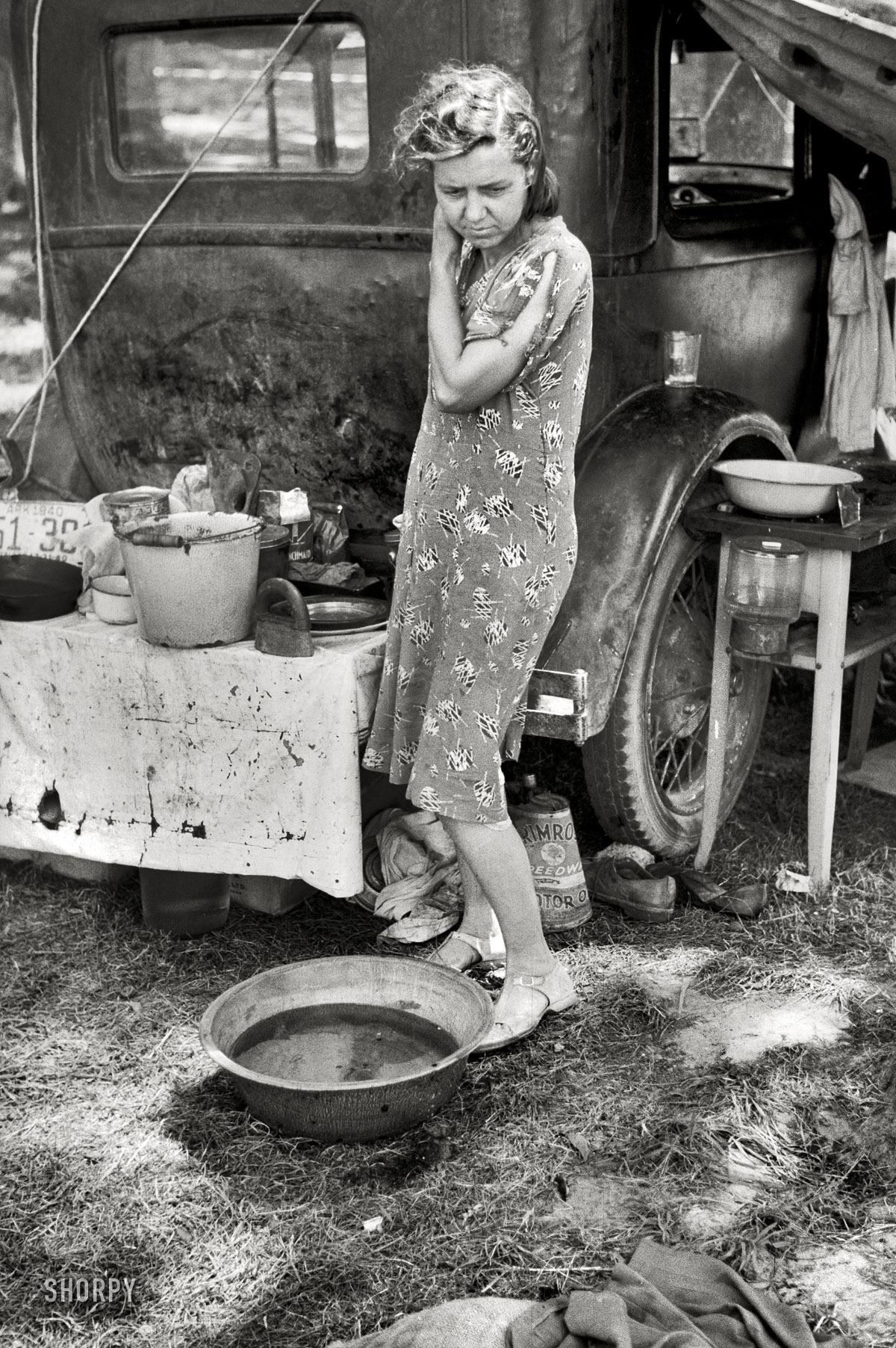 July 1940. Berrien County, Michigan. "Migrant mother of family from Arkansas in roadside camp of cherry pickers." Our second look at the lady seen here last week. 35mm nitrate negative by John Vachon. View full size.