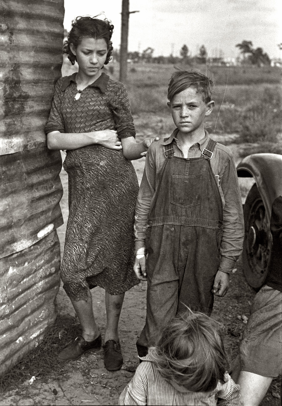 January 1937. "Part of the family of a migrant fruit worker from Tennessee, camped near the packinghouse in Winter Haven, Florida." View full size. 35mm nitrate negative by Arthur Rothstein for the Farm Security Administration.