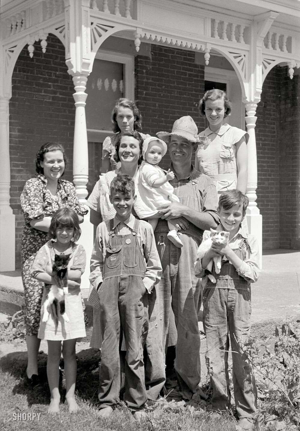 May 1938. "Farm family, Scioto Farms, Ohio." 35mm nitrate negative by Arthur Rothstein for the Farm Security Administration. View full size.
UPDATE: This is Earl Armentrout and his family, government rehabilitation clients who were relocated by the Resettlement Administration to a new house in a cooperative farming project, a story repeated thousands of times for families who were forced off the land by crop failures during the Dust Bowl era.