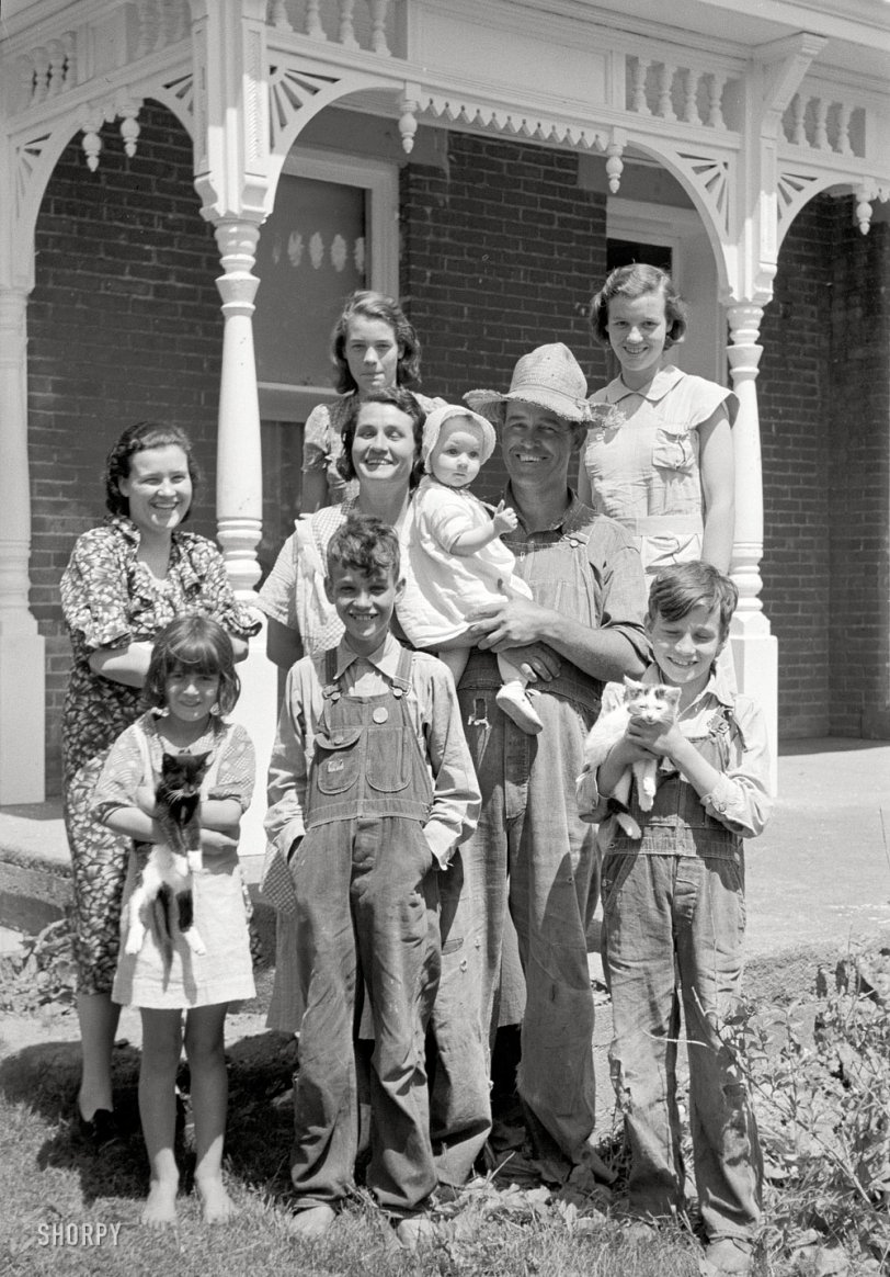 May 1938. "Farm family, Scioto Farms, Ohio." 35mm nitrate negative by Arthur Rothstein for the Farm Security Administration. View full size.
UPDATE: This is Earl Armentrout and his family, government rehabilitation clients who were relocated by the Resettlement Administration to a new house in a cooperative farming project, a story repeated thousands of times for families who were forced off the land by crop failures during the Dust Bowl era.
