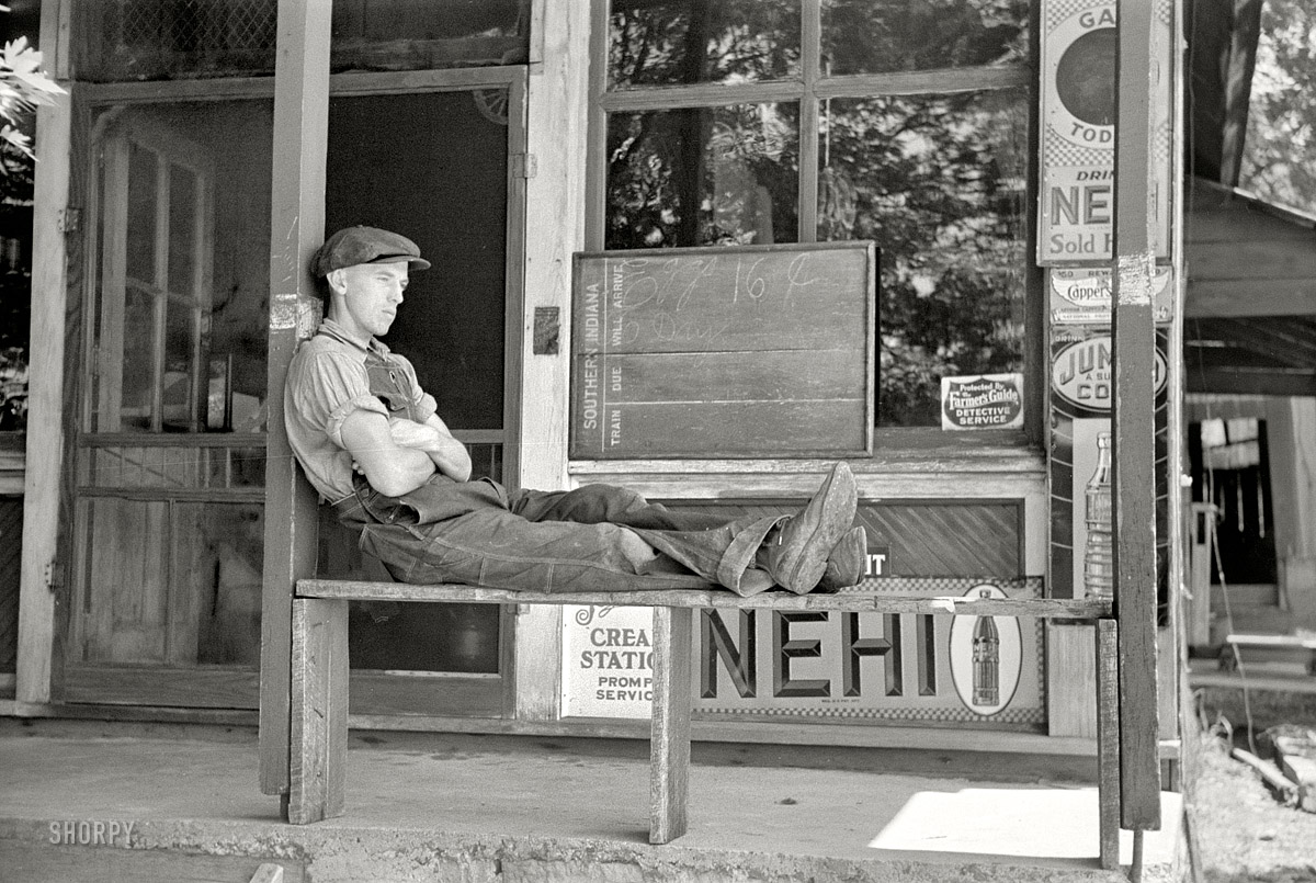 May 1938. Blankenship, Indiana. "Resting in front of general store." 35mm negative by Arthur Rothstein, Farm Security Administration. View full size. 